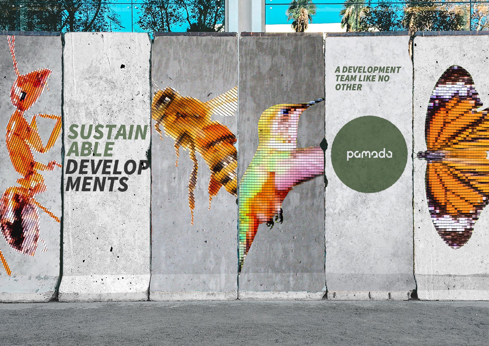 Pixelated ant, bee, hummingbird, butterfly art on concrete barriers with "Sustainable Developments" text.