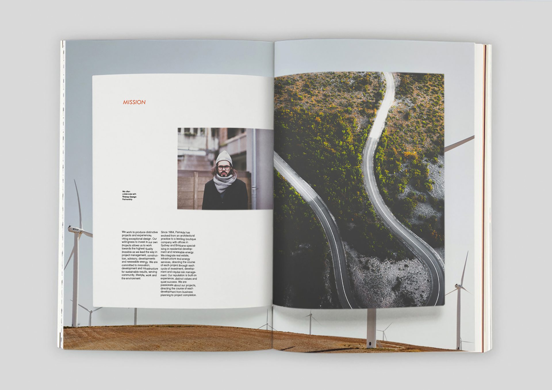 Magazine spread: "MISSION" text, man's portrait, aerial winding road, wind turbines.