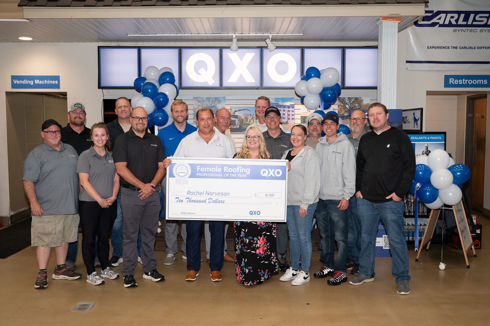 Group presents a $10,000 check to Rachel Narveson, "Female Roofing Professional of the Year."