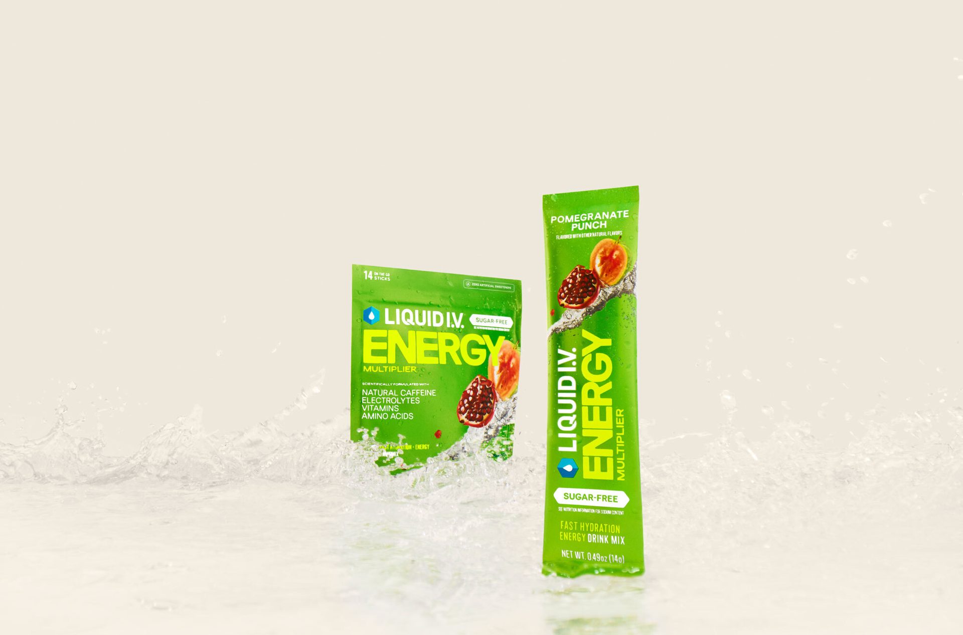 Liquid I.V. Energy Pomegranate Punch multi-pack and single stick with water splashes.