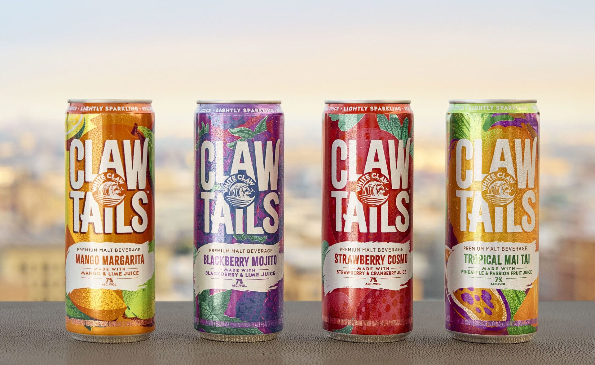 Four White Claw Claw Tails cans: Mango Margarita, Blackberry Mojito, Strawberry Cosmo, Tropical Mai Tai.