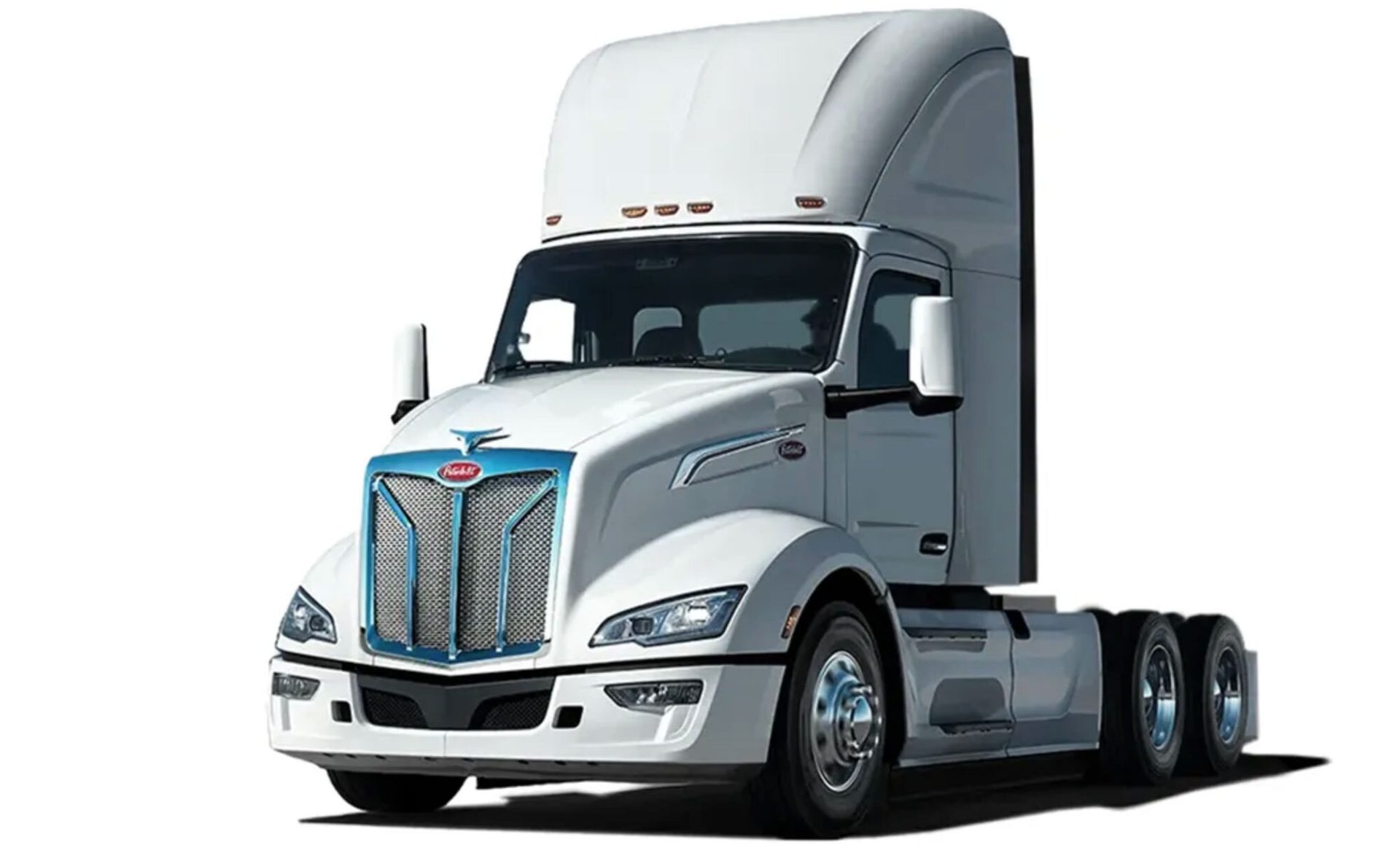 White Peterbilt semi-truck with blue grille and sleeper cab.