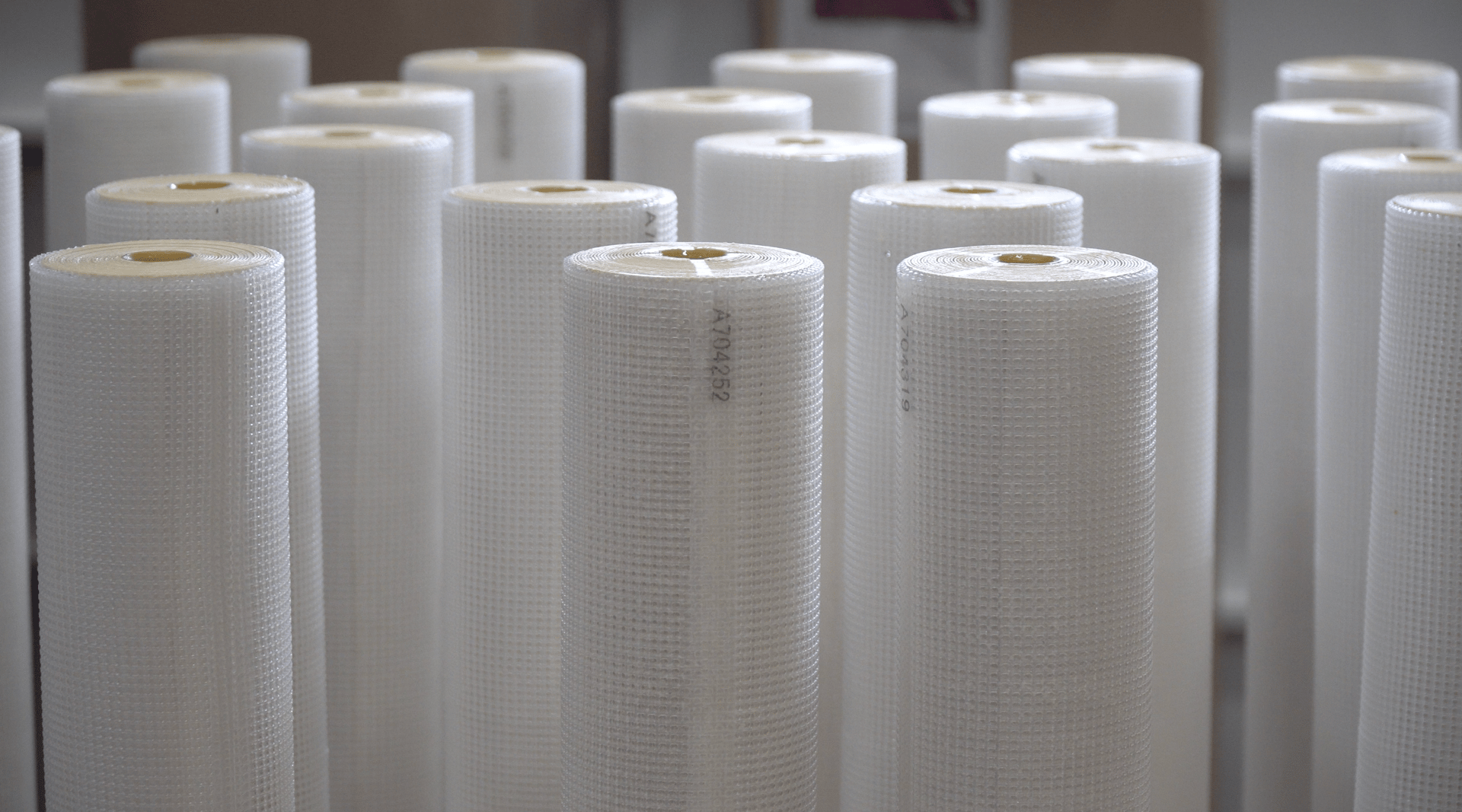 White mesh rolls, some labeled.