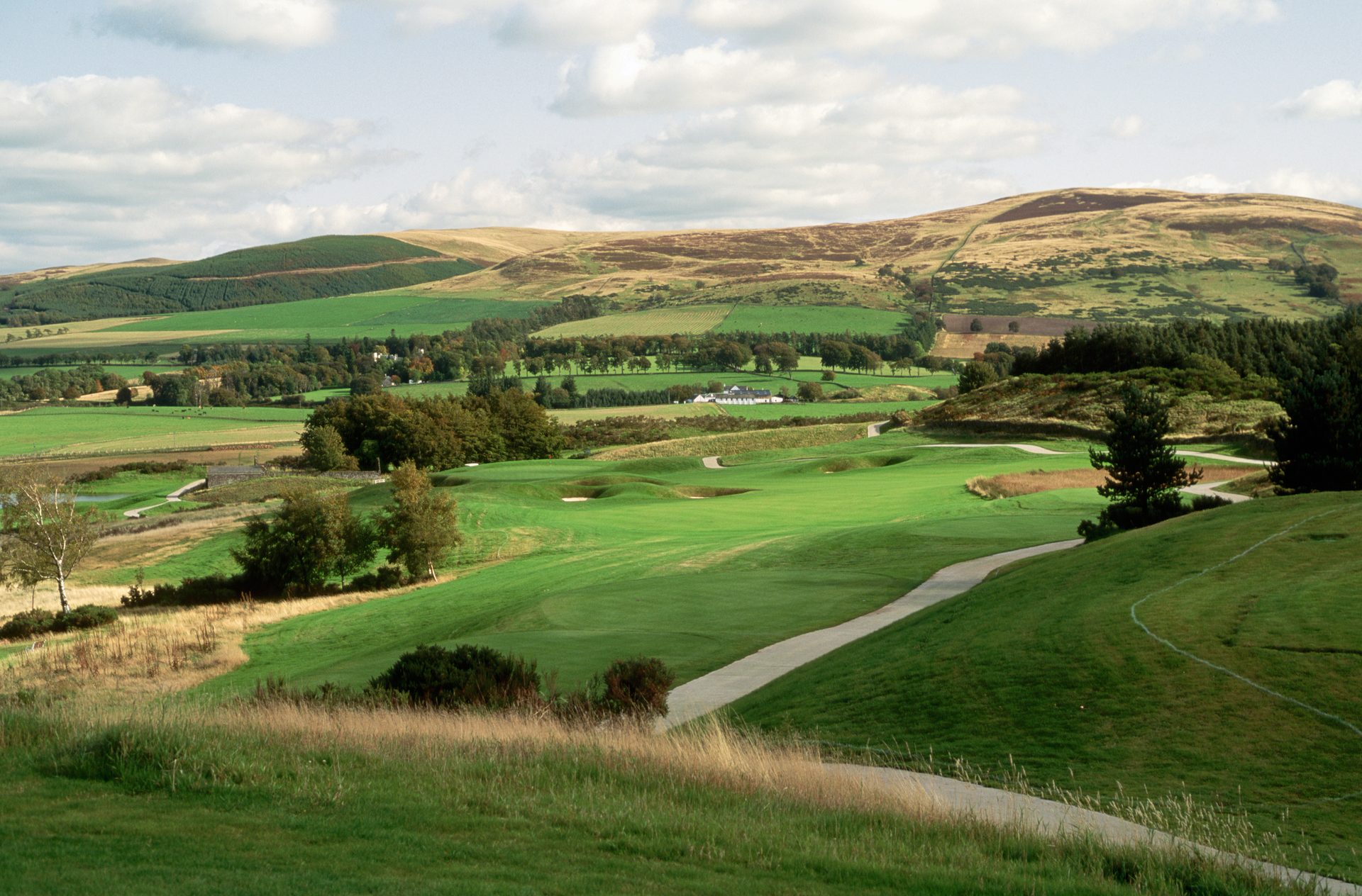 Natural landscape, Sky, Plant, Cloud, Ecoregion, Mountain, Golf, Tree, Highland