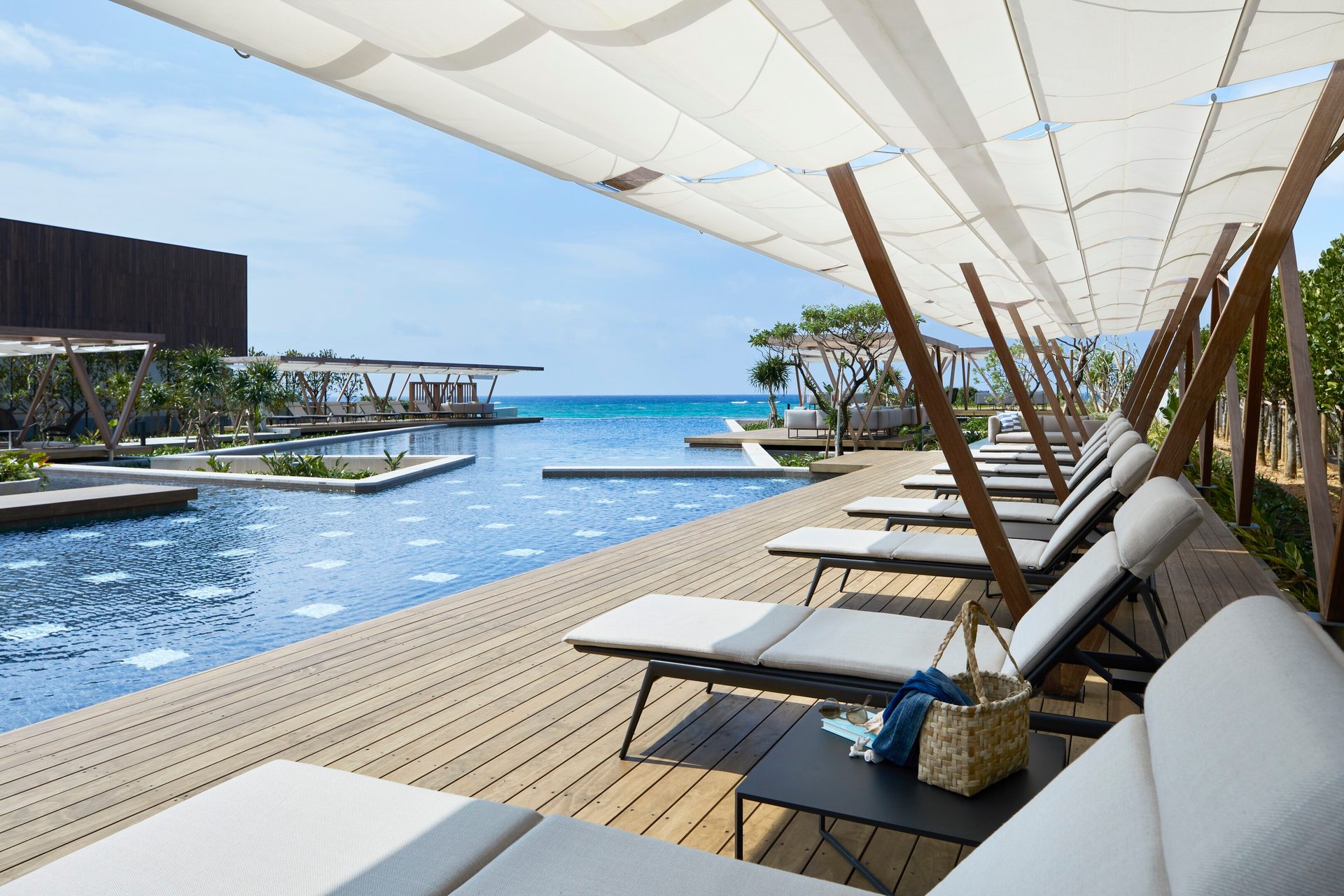 Outdoor furniture, Swimming pool, Interior design, Water, Sky, Property, Azure, Shade, Building