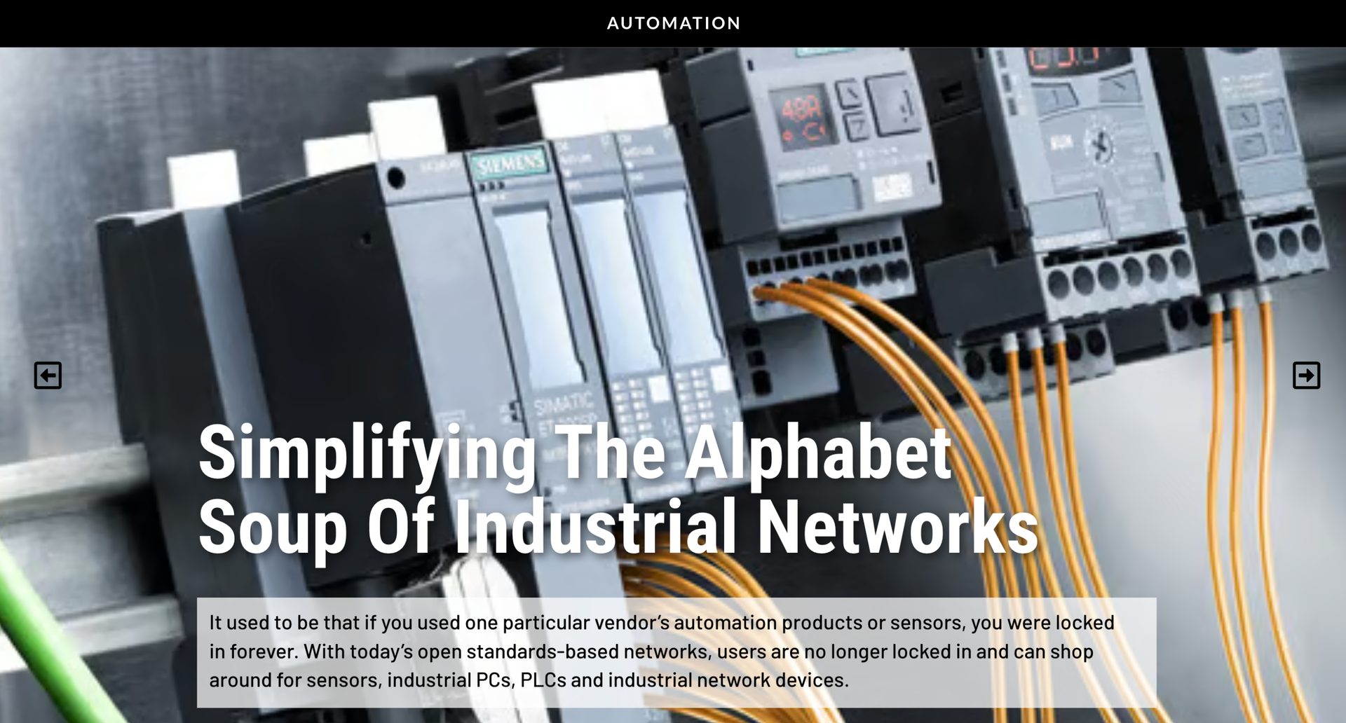 Close-up of Siemens industrial automation modules with orange wires, showing network setup.