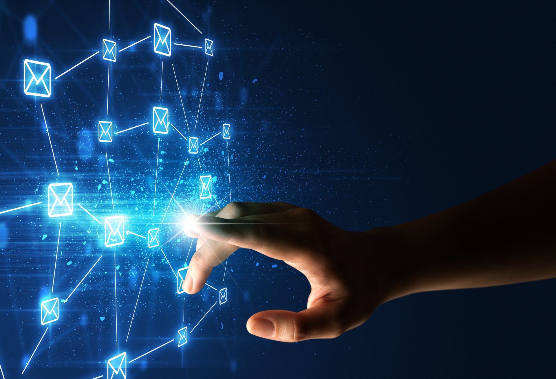 Hand touching a bright, blue, connected email icon network.