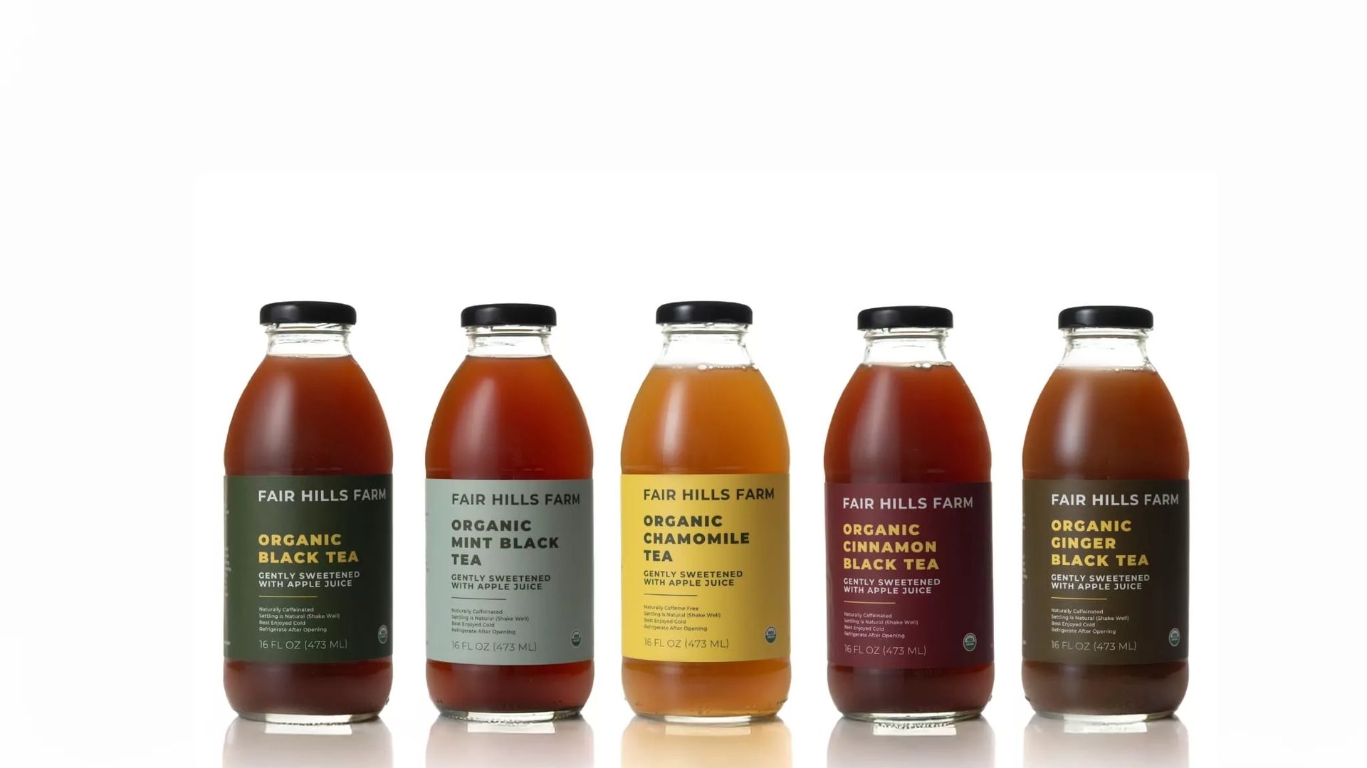 Five Fair Hills Farm organic teas in bottles: Black, Mint Black, Chamomile, Cinnamon Black, Ginger Black.