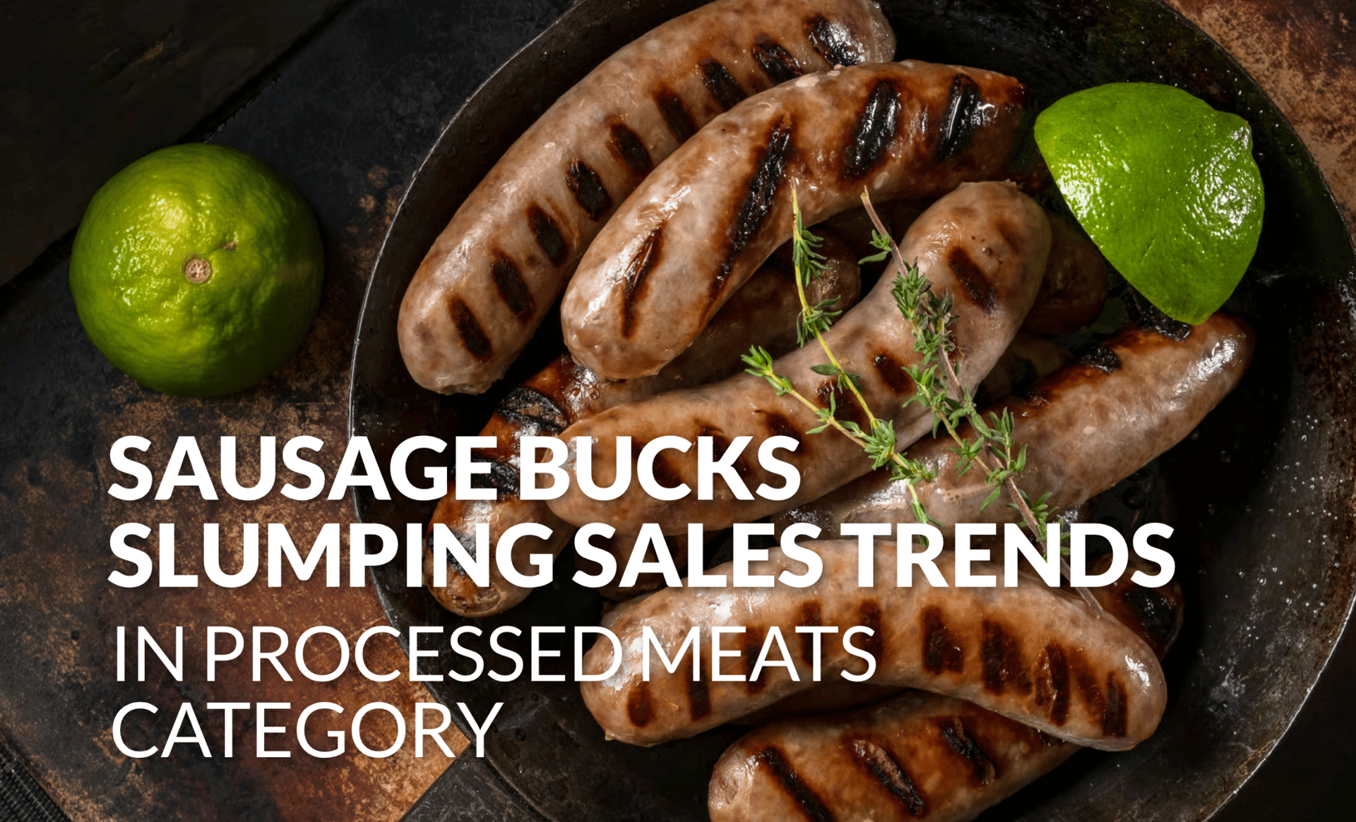 Grilled sausages with lime and herbs in a pan. Text on sausage sales bucking processed meat trends.