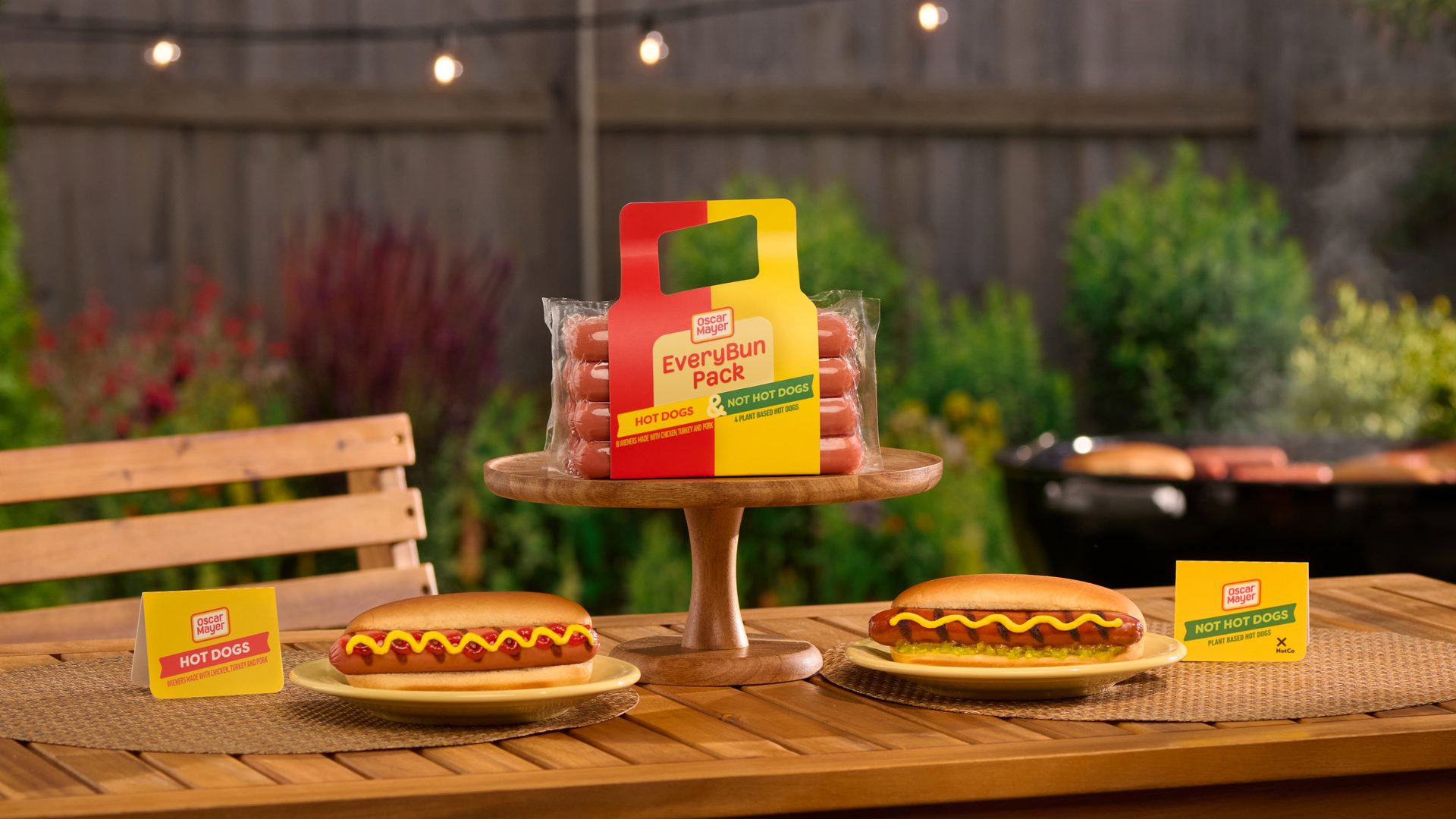 Oscar Mayer EveryBun Pack with hot dogs & plant-based dogs, prepared, at a backyard BBQ.