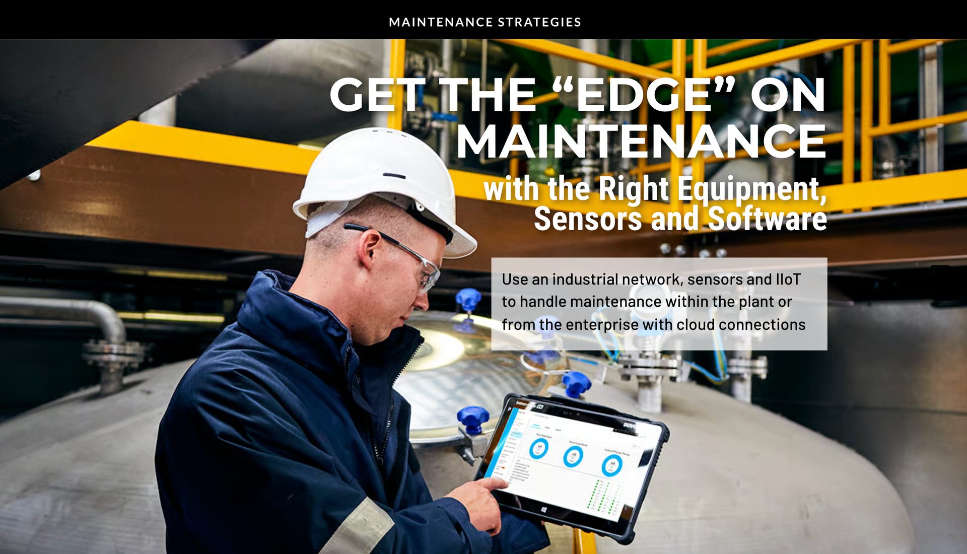 Man in hard hat uses tablet in industrial plant for smart maintenance strategies.