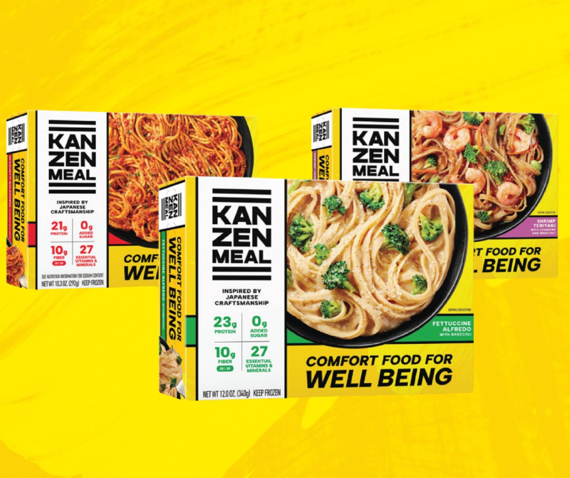 Three Kan Zen Meal pasta boxes: Spaghetti Bolognese, Fettuccine Alfredo, Shrimp Teriyaki on yellow.