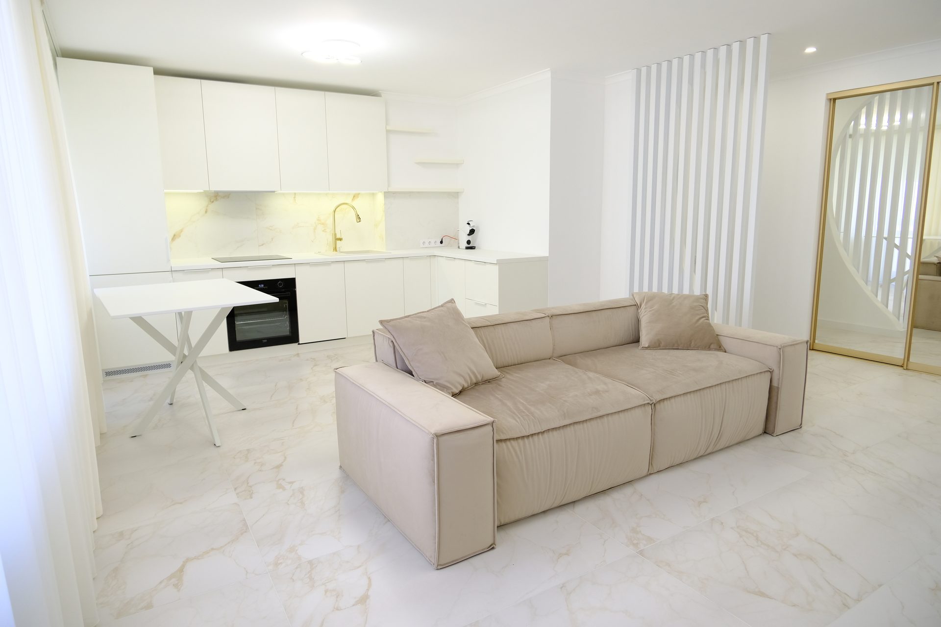 Interior design, Living room, Couch, Flooring, Grey, Floor, Beige, Wall, Comfort, Wood