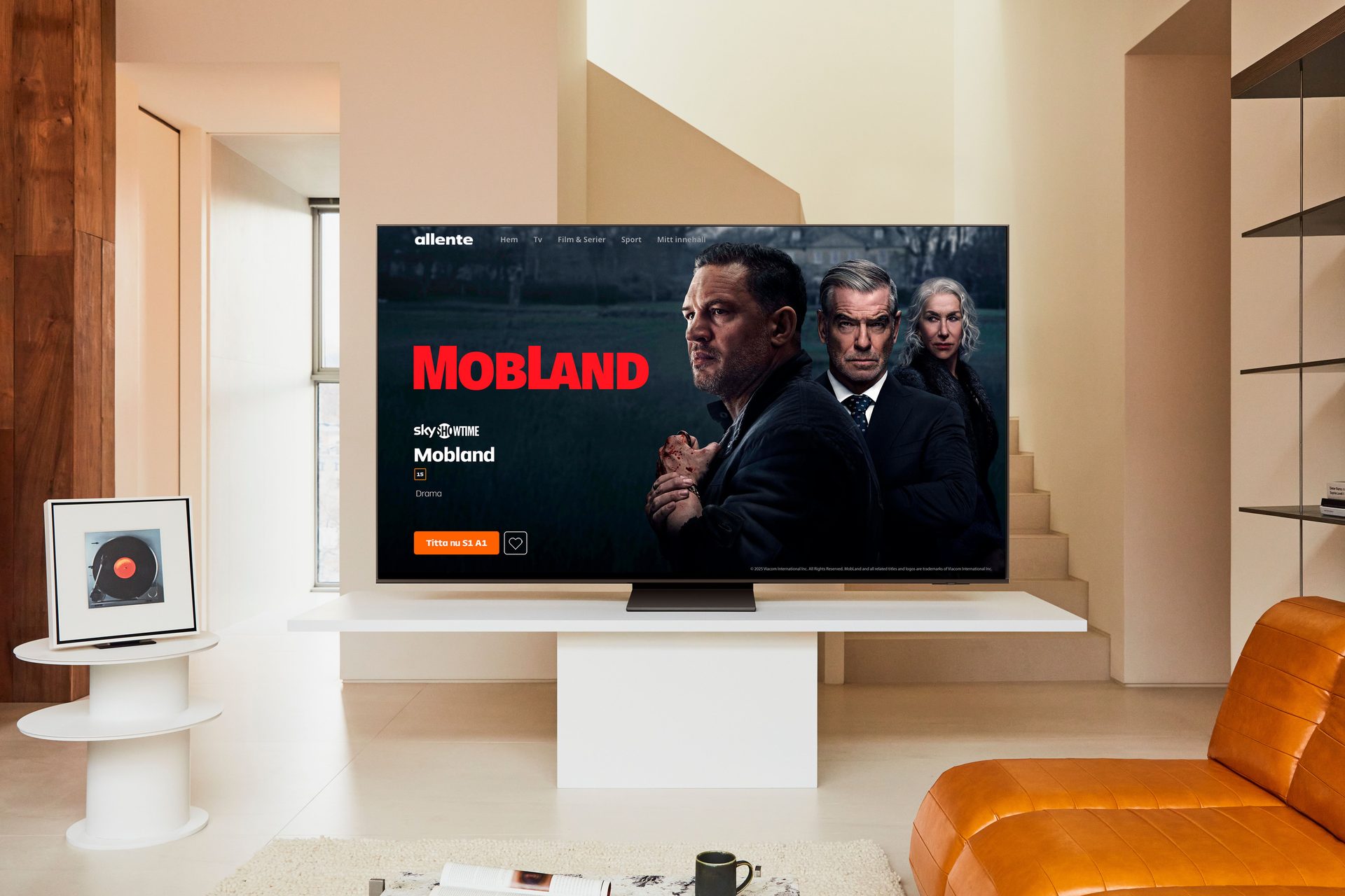 A TV displays "Mobland" from SkyShowtime in a modern living room.