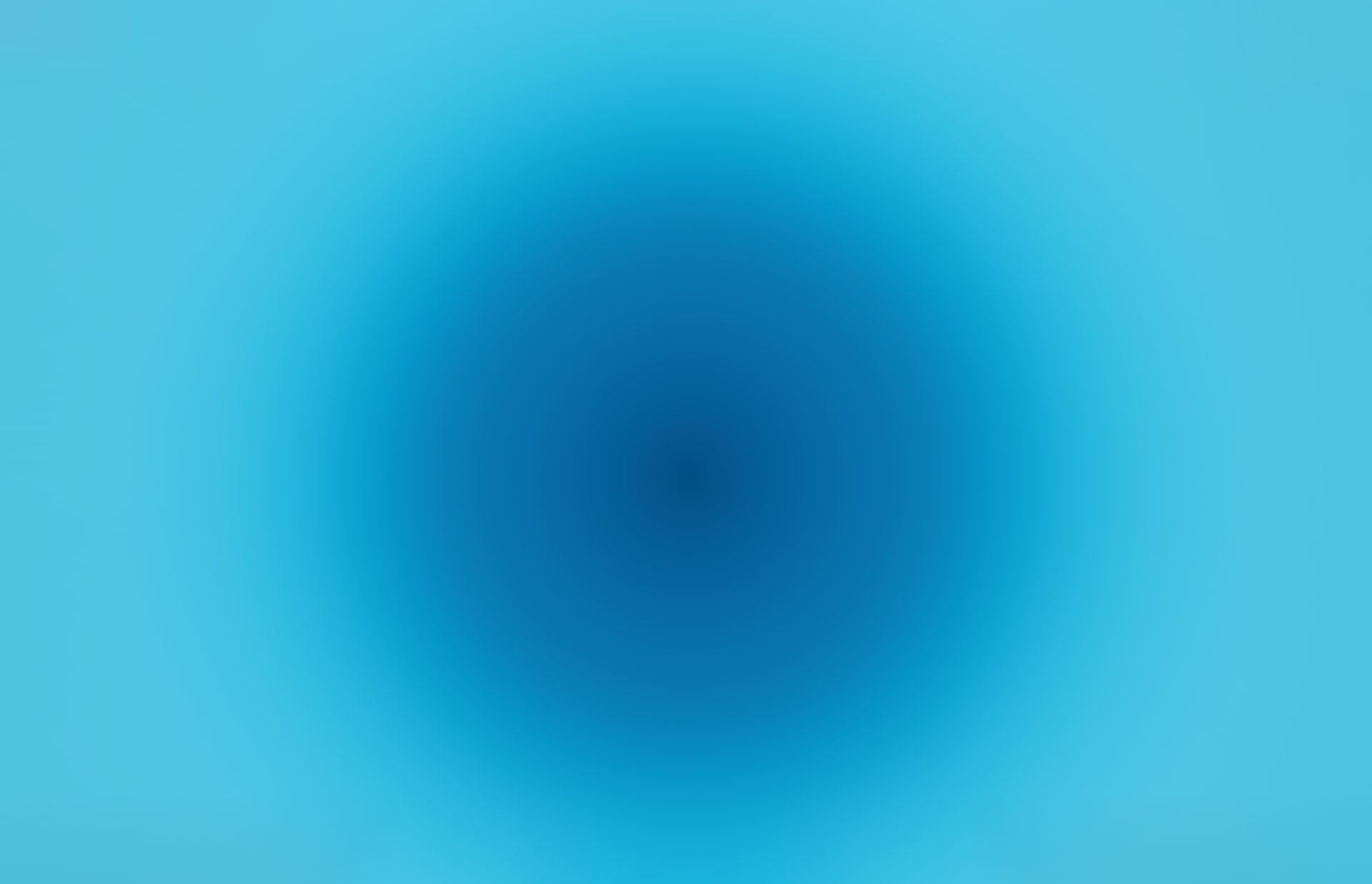 A radial gradient with a dark blue center fading to lighter blues towards the edges.