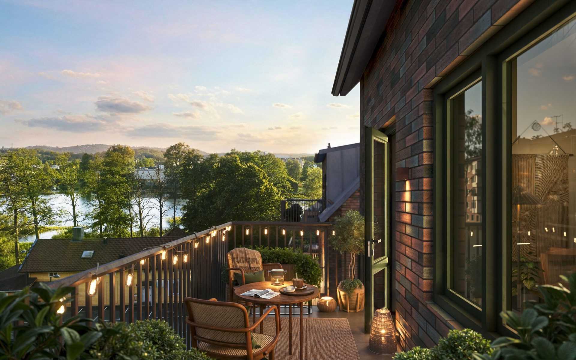 Cozy balcony with string lights, outdoor furniture, scenic lake and sunset view.