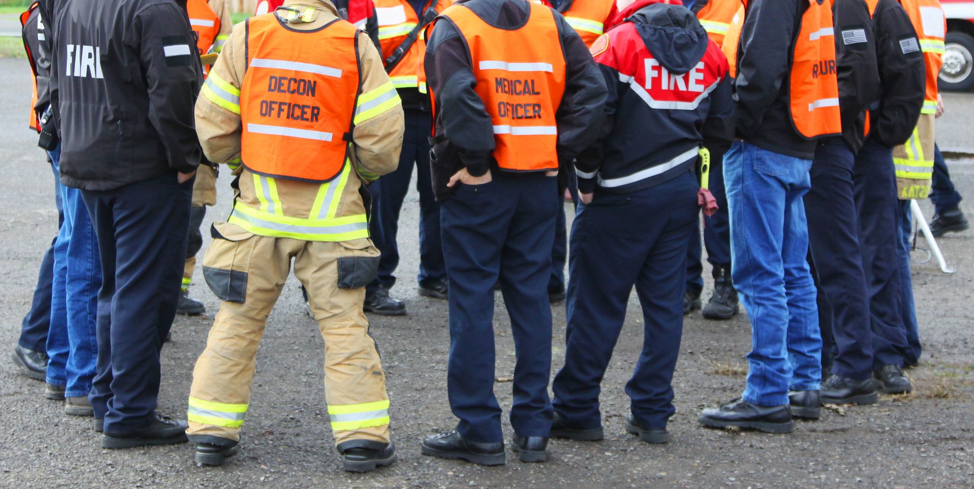 High-visibility clothing, Workwear, Sleeve, Gesture, Asphalt, Helmet