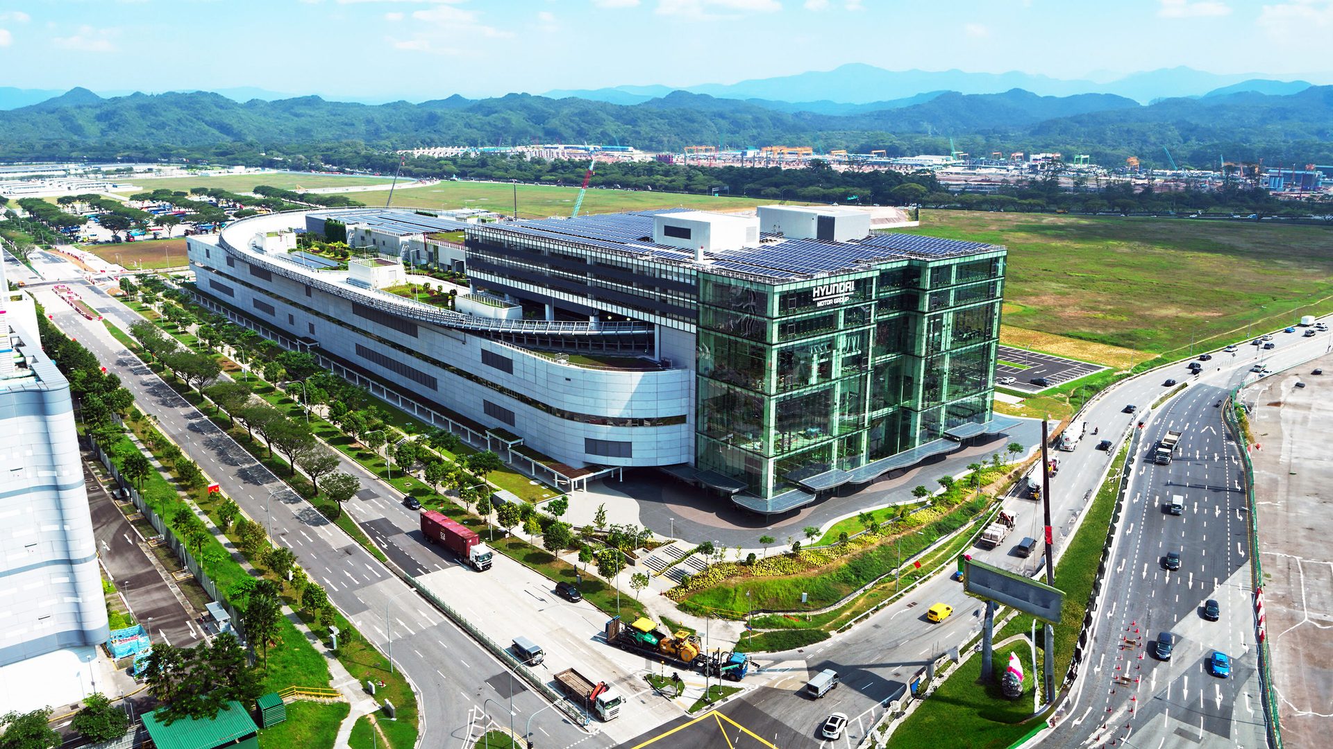 Transport hub, Urban design, Residential area, Sky, Building, Cloud, Infrastructure, Car, Architecture, Landscape