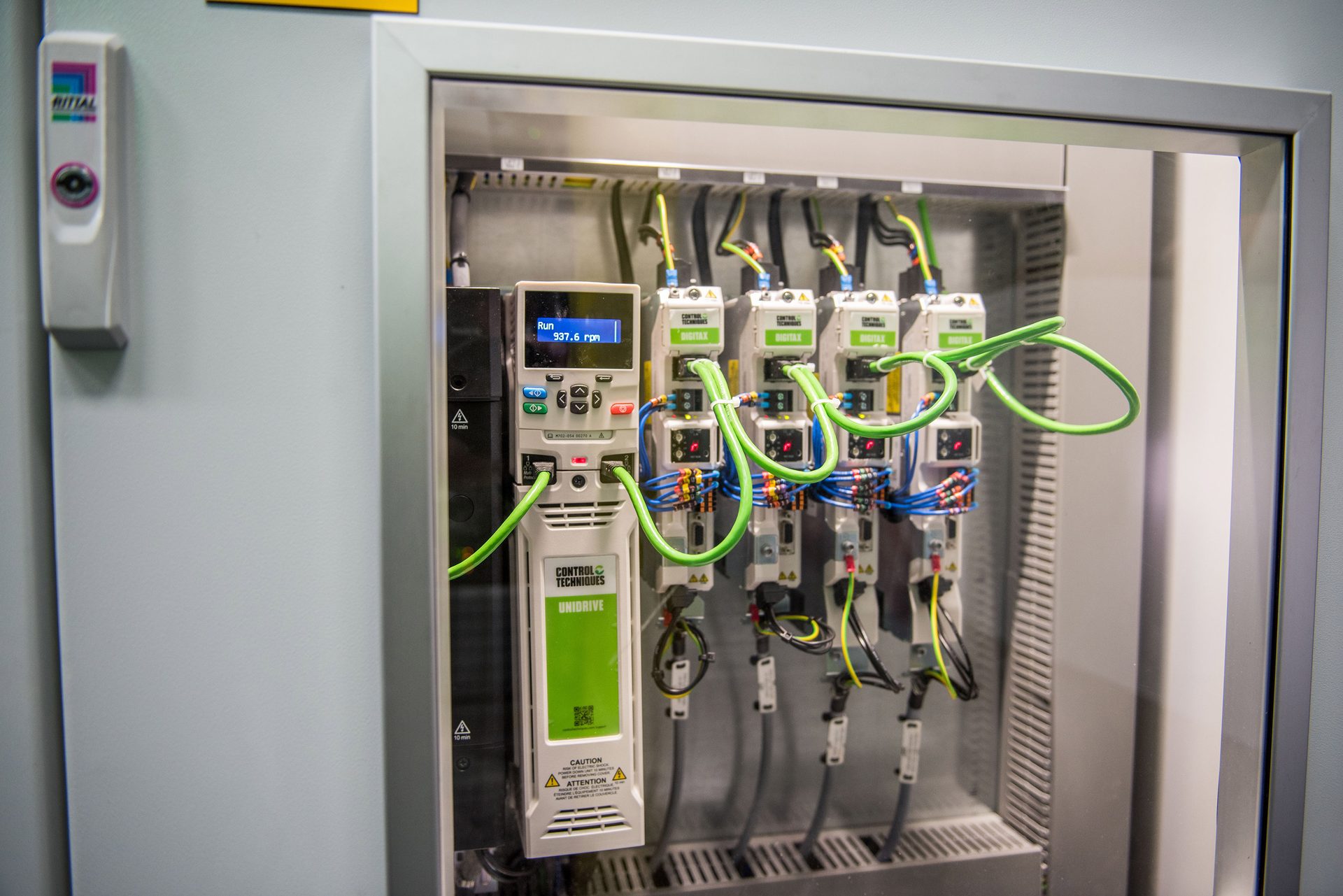 Industrial electrical cabinet with Control Techniques Unidrive and Digitax motor drives and wiring.