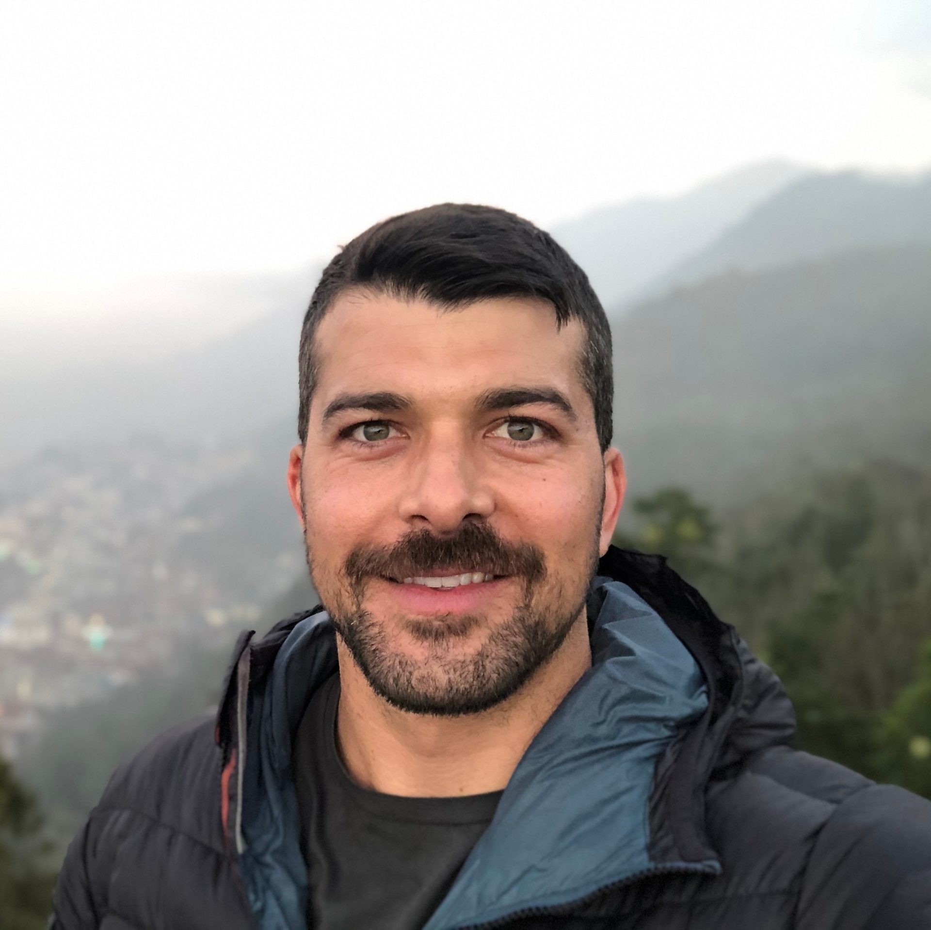 Atmospheric phenomenon, Forehead, Smile, Outerwear, Sky, Beard, Mountain, Happy, Travel