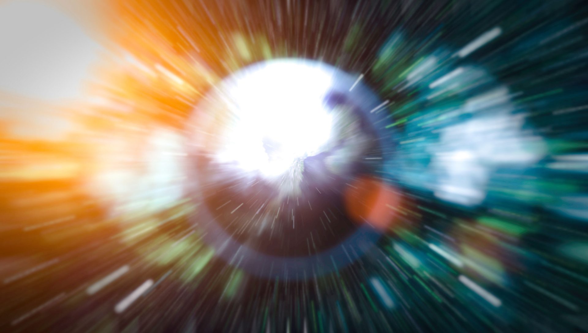 Bright, blurry light burst with orange, blue, and green radial lines, conveying speed.