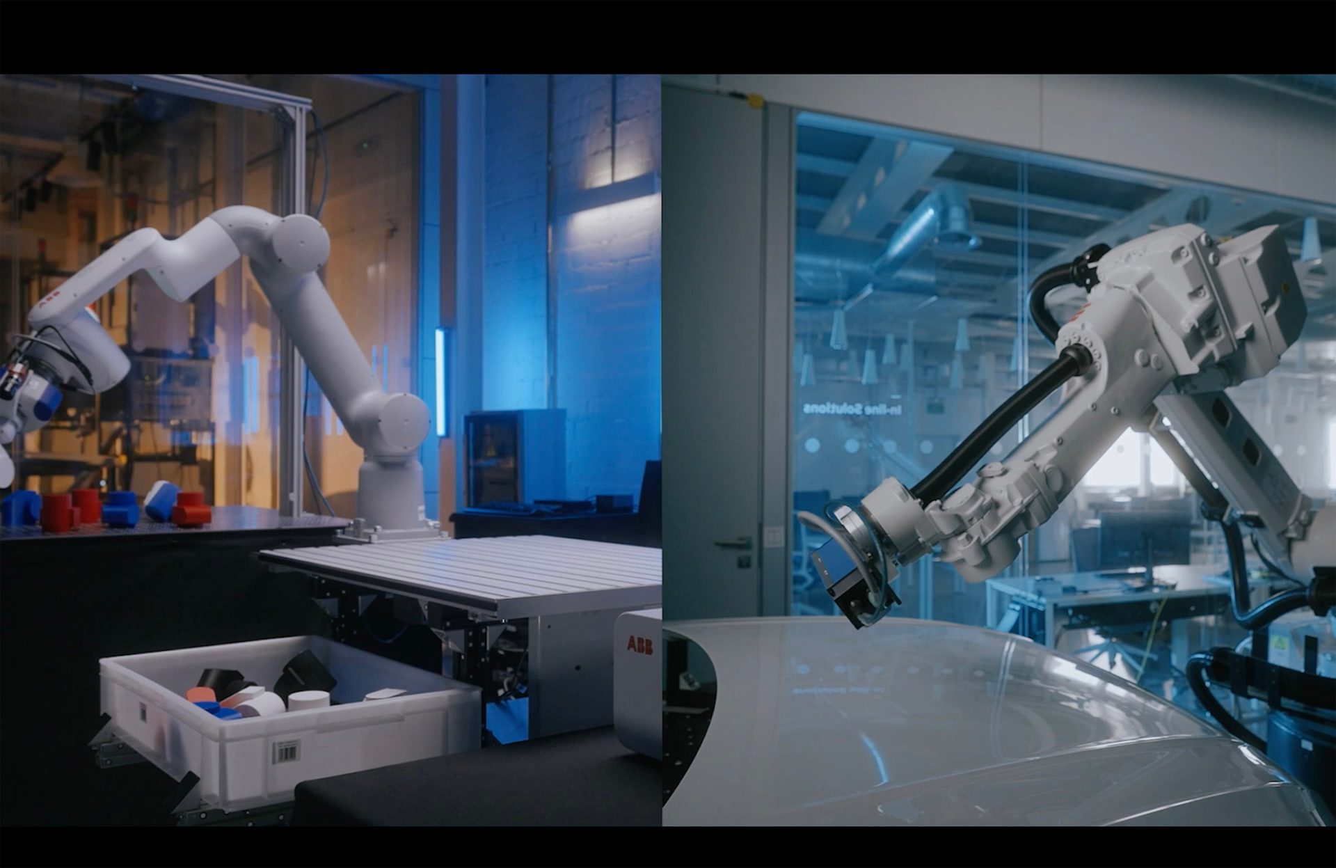 Two industrial robotic arms at work: one with colored blocks, the other inspecting a white surface.