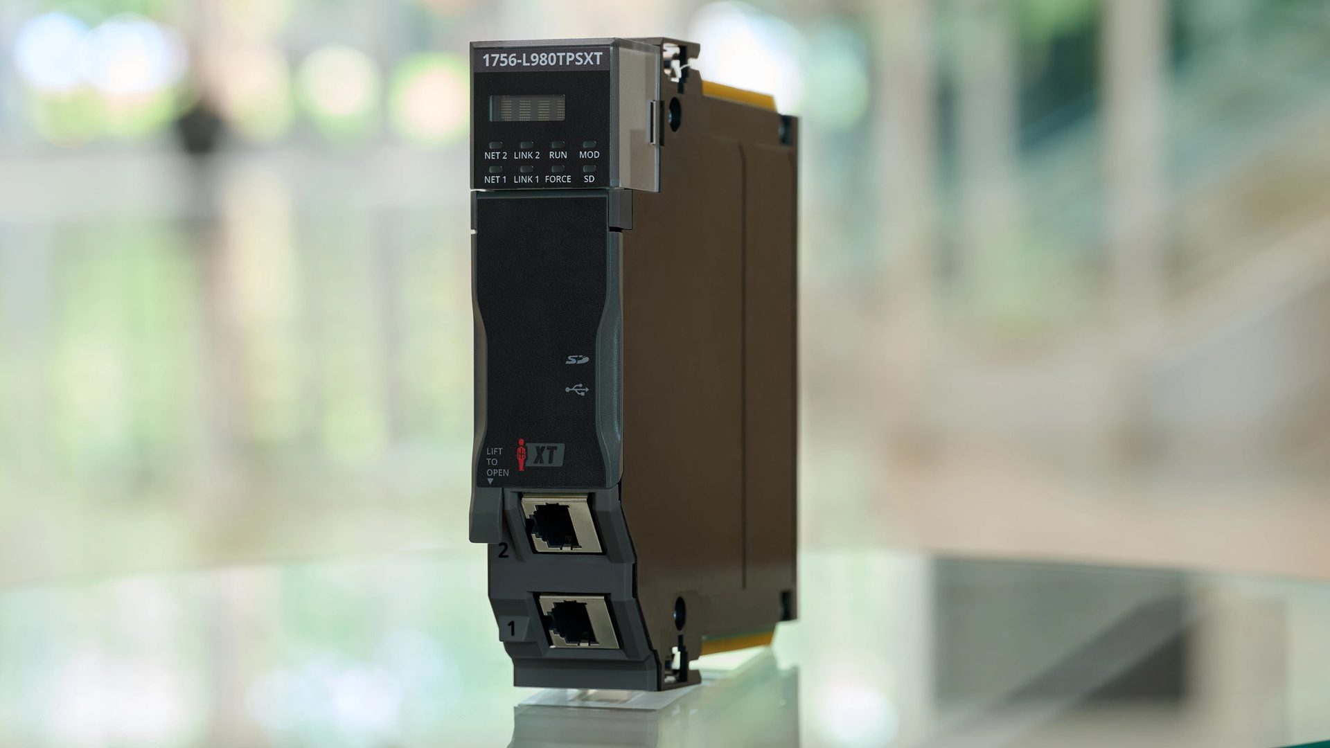 Close-up of a 1756-L980TPSXT ControlLogix processor module, showing its ports and indicators.