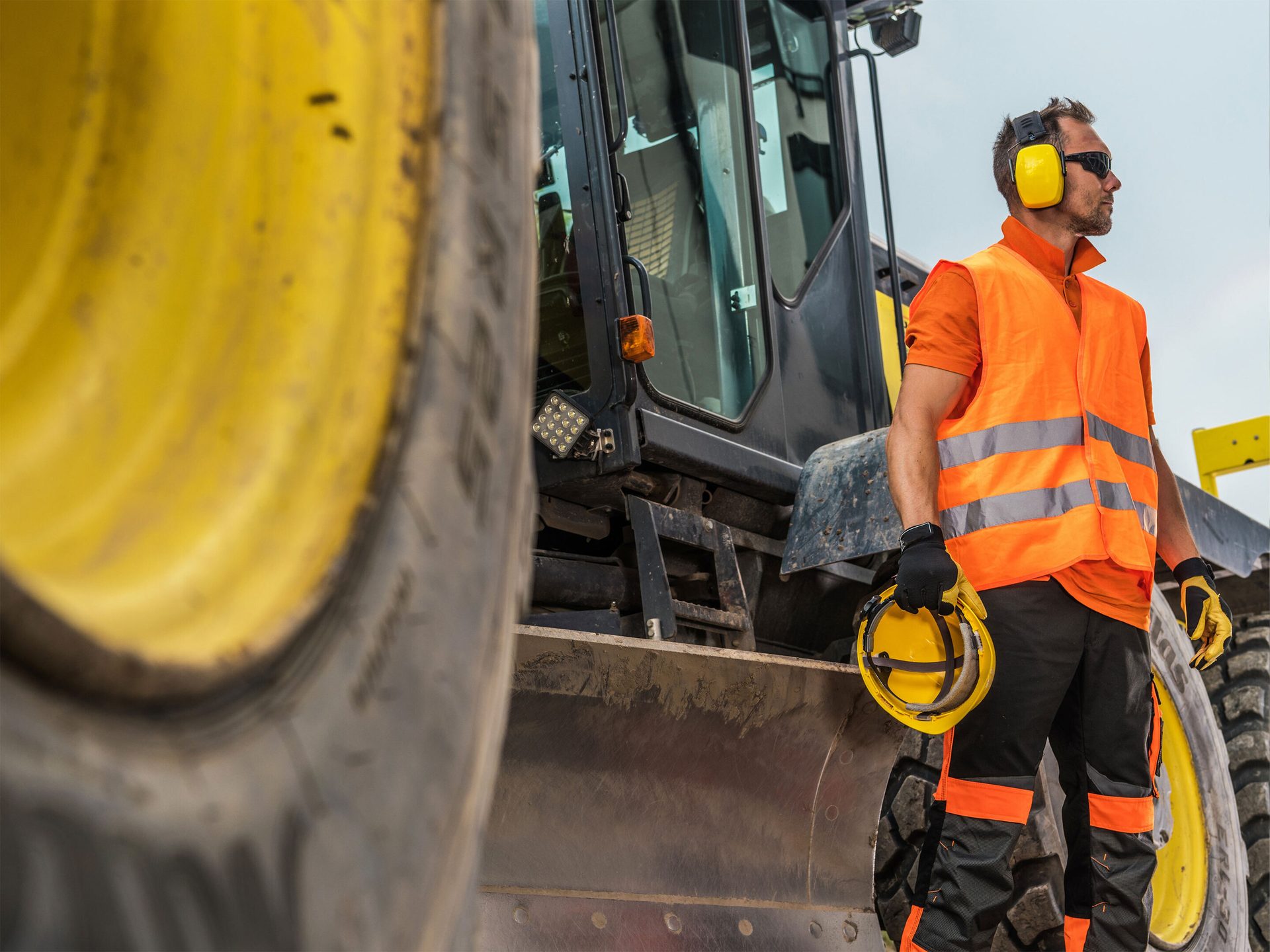 High-visibility clothing, Motor vehicle, Hard hat, Automotive tire, Wheel, Workwear, Helmet, Sky