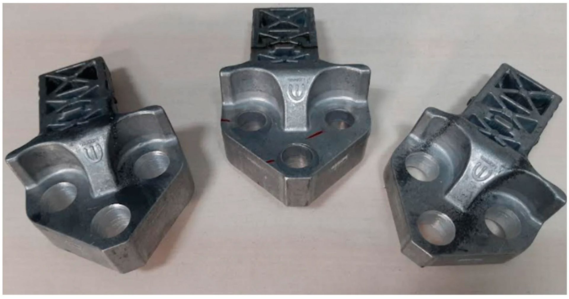 Three identical silver-colored metal industrial components with holes and a latticed structure.