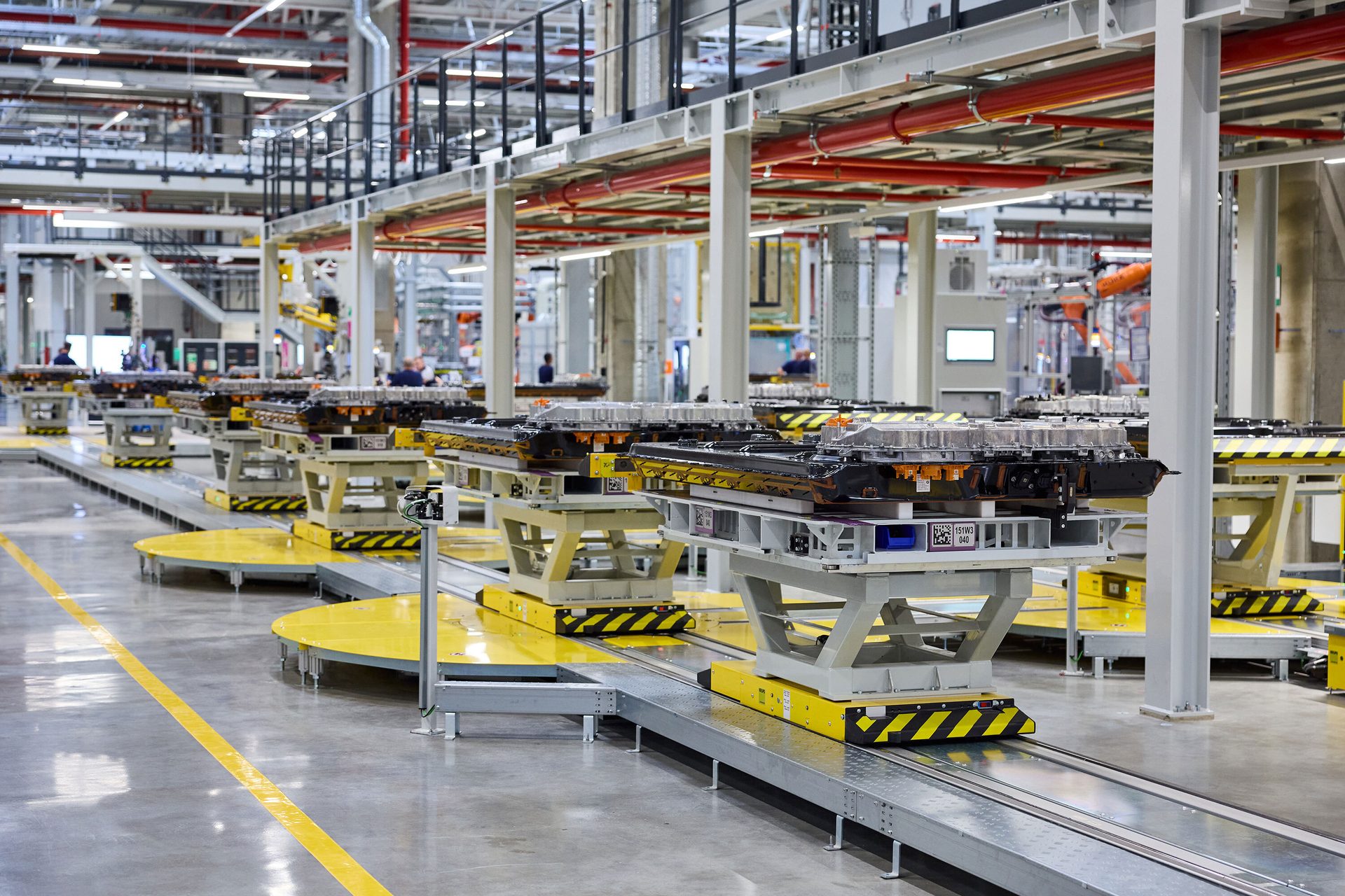 EV battery packs on an automated assembly line.