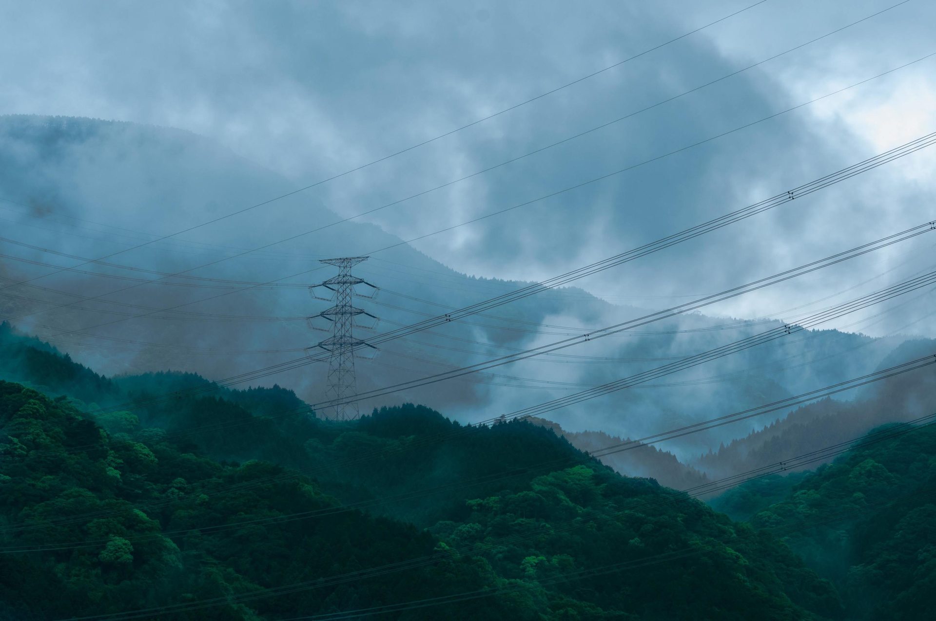 Overhead power line, Natural environment, Cloud, Sky, Atmosphere, Mountain, Ecoregion, Slope, Electricity, Highland