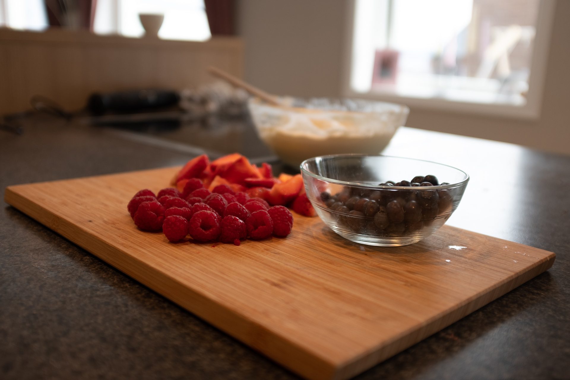 Cutting board, Mixing bowl, Food, Table, Tableware, Dishware, Fruit, Ingredient, Recipe, Berry