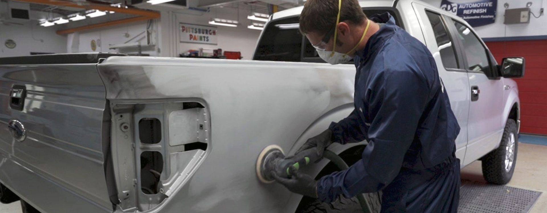 Illustrating the proper sanding technique for primer surfacer to ensure uniform surface preparation and reliable repair performance