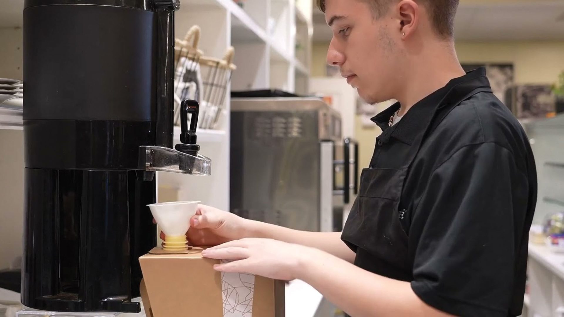 Employee Pours Coffee in Assembled Box