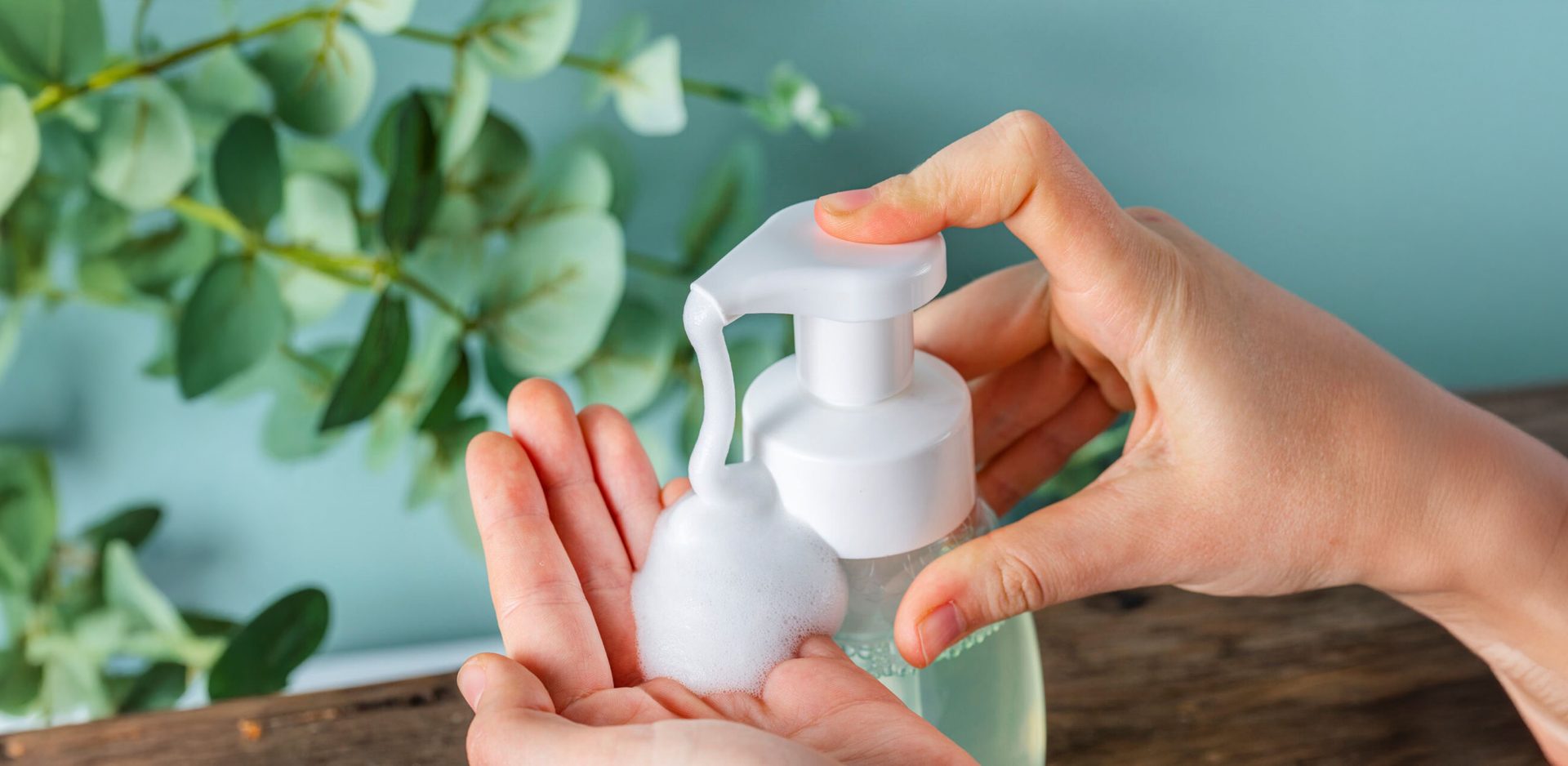 Hand pumping soap into other hand