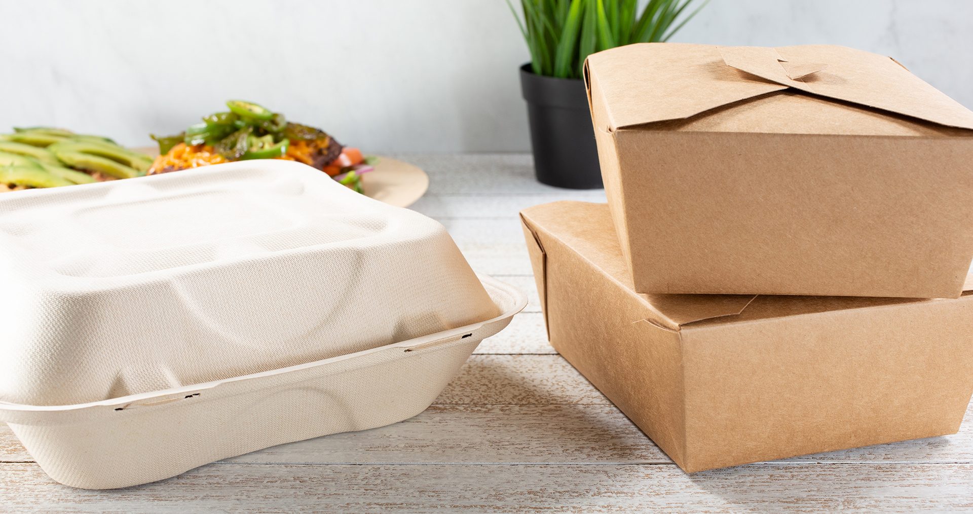 A view of a variety of to-go containers featuring clamshell and folding boxes