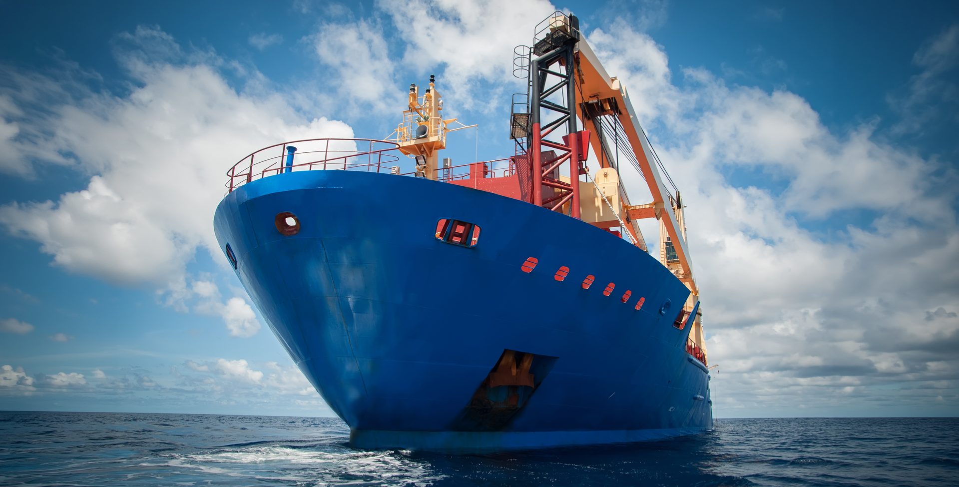 Close up of a blue vessel's view in the middle of the ocean