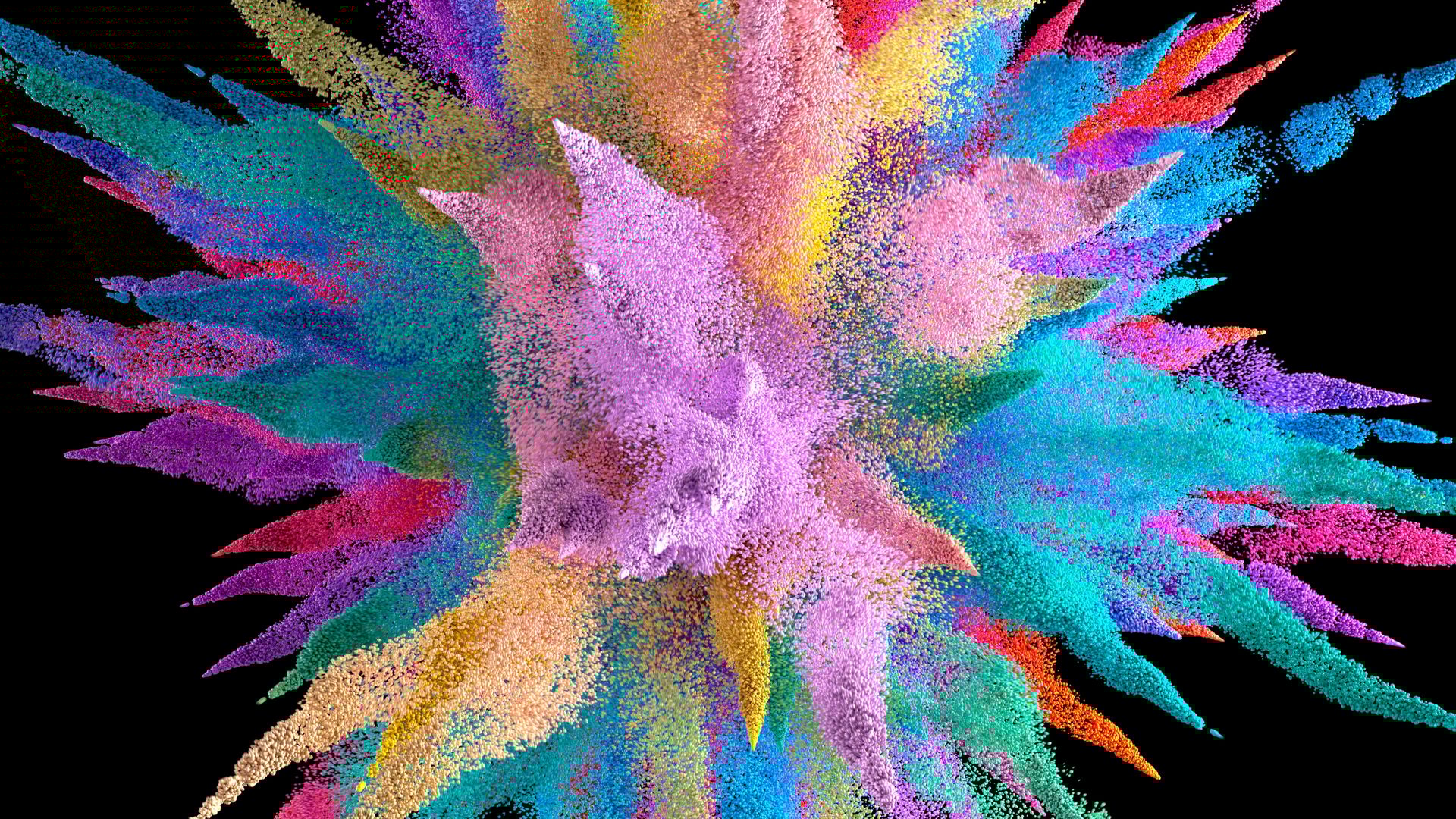 A vibrant explosion of multicolored powder against a black background.