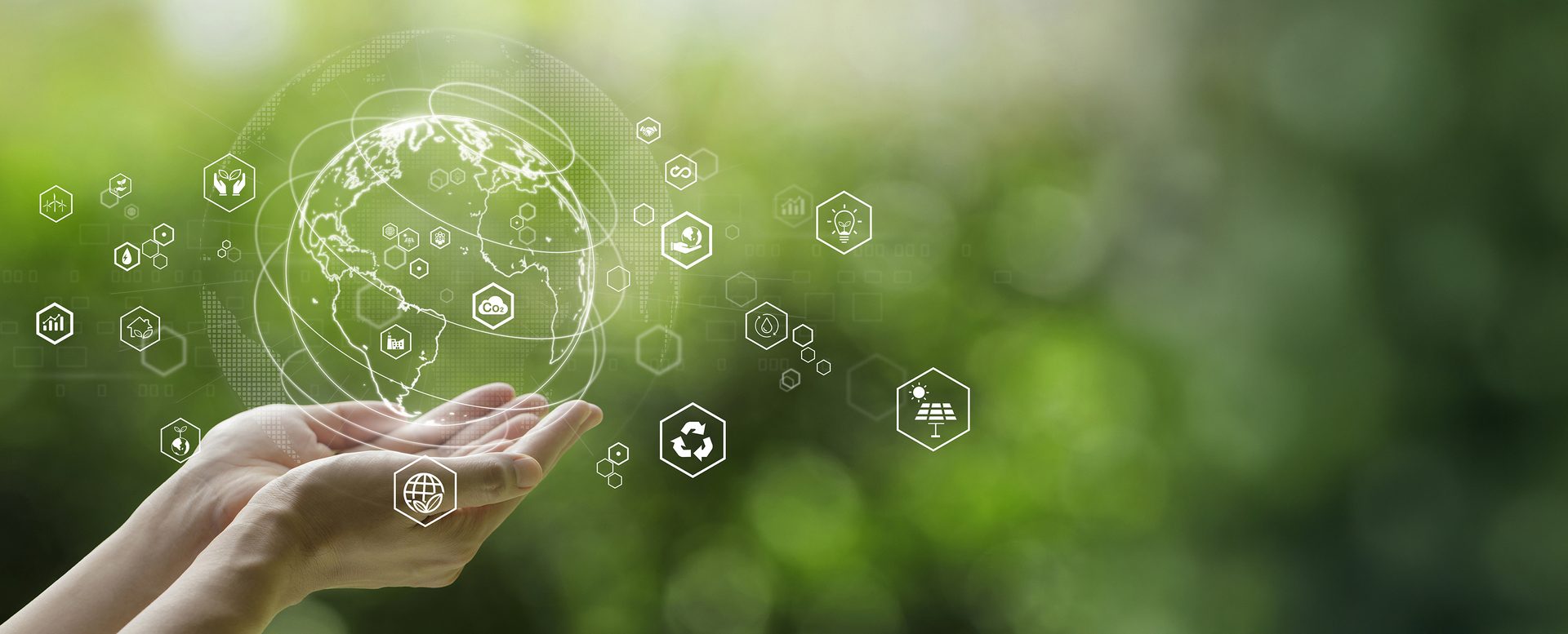 Hands holding global communication network with environment icon on a green background