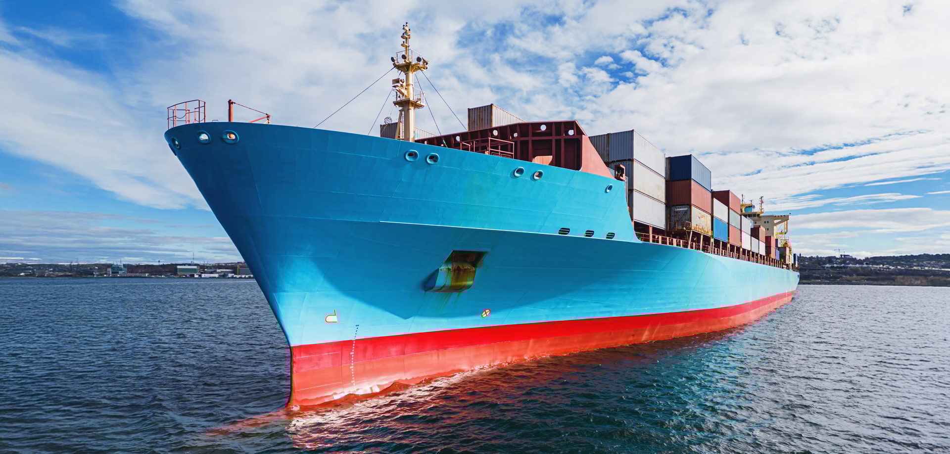 Aerial drone view of a container ship anchored in a harbor
