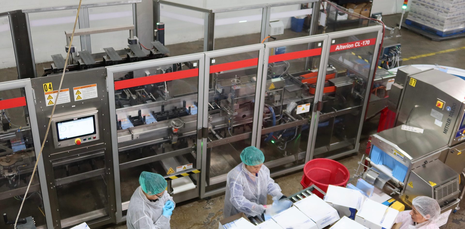 Employees at GreenSeed’s Batavia, Illinois, facility load the bag-in-box product into cartons on the production line.