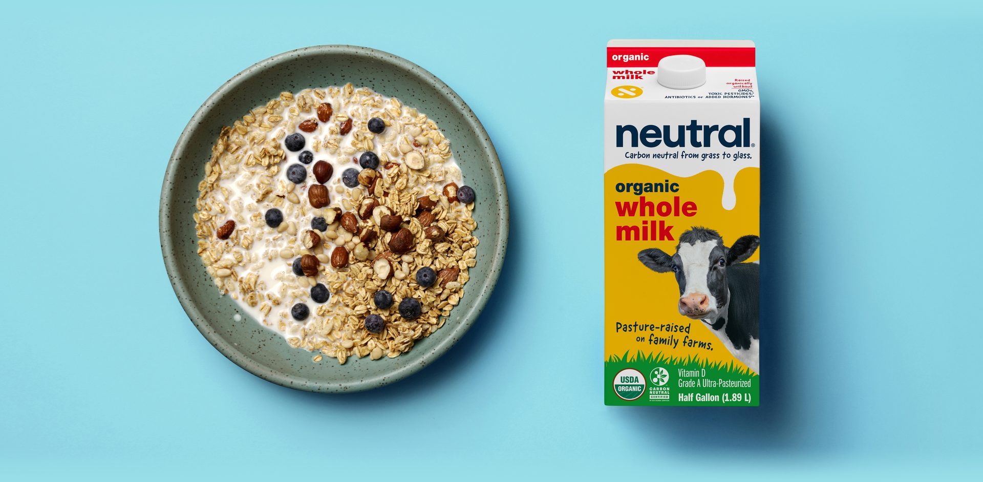 Glass of milk with bowl of cereal