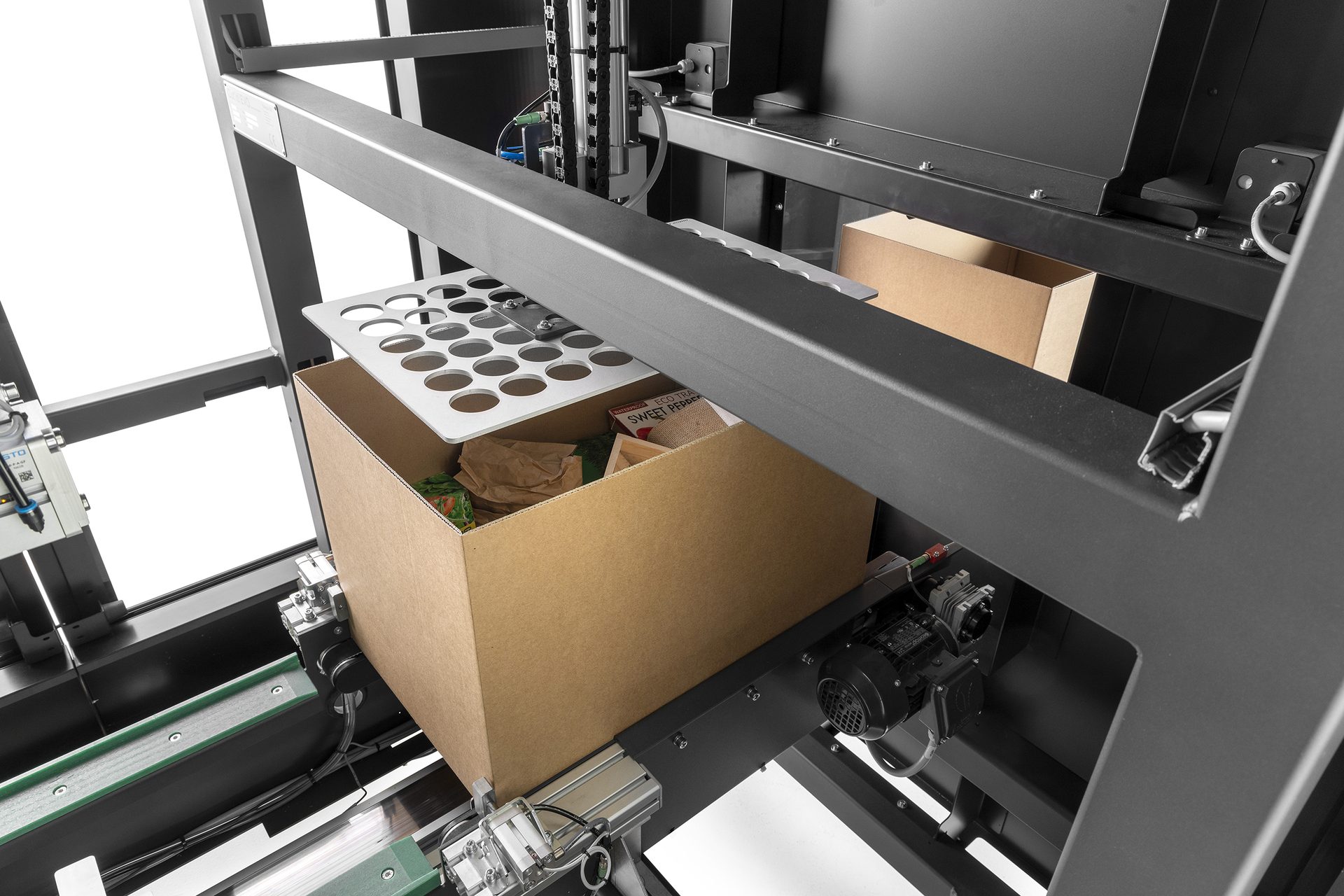Equipment performing a height measuring scan on a package