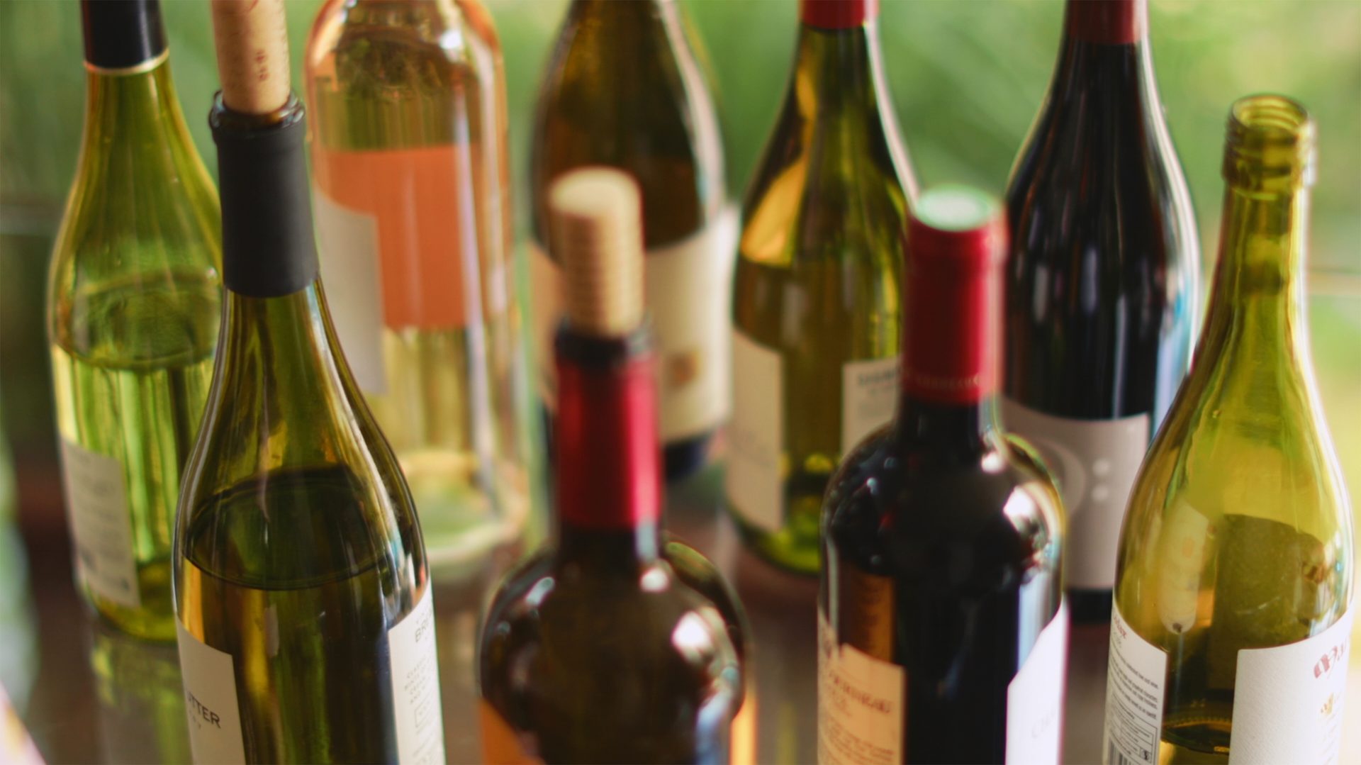 Variety of wine bottles on table