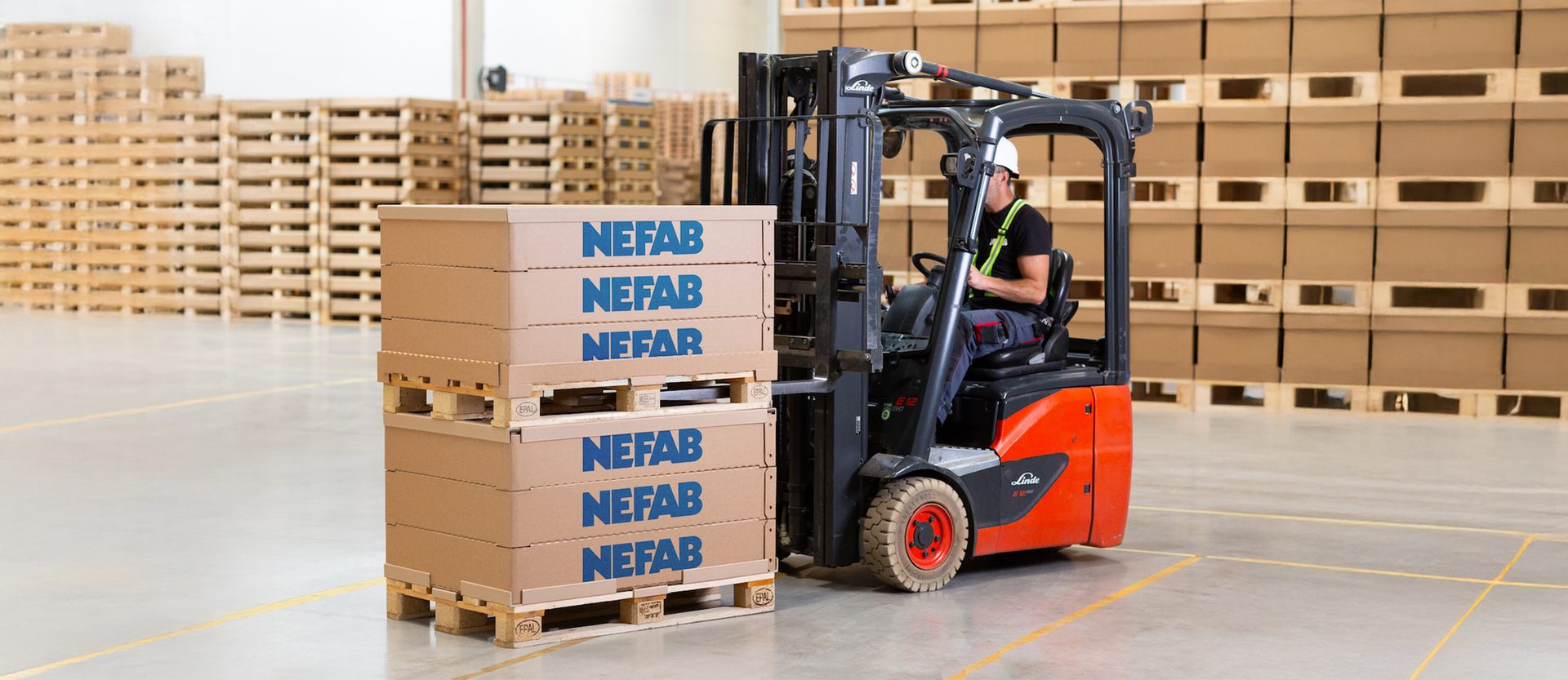 Forklift operator loading pallet with Nefab EdgePak Collar