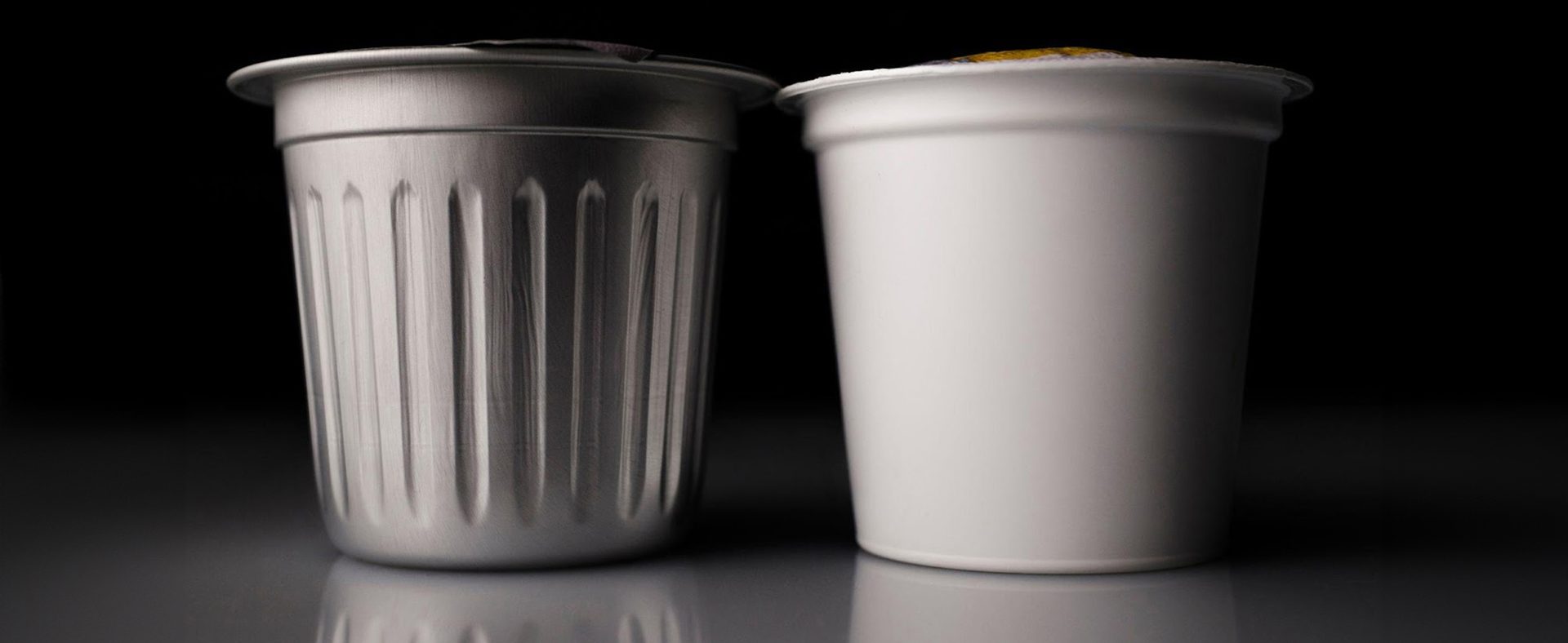 Close up of two Cambio aluminum coffee pods