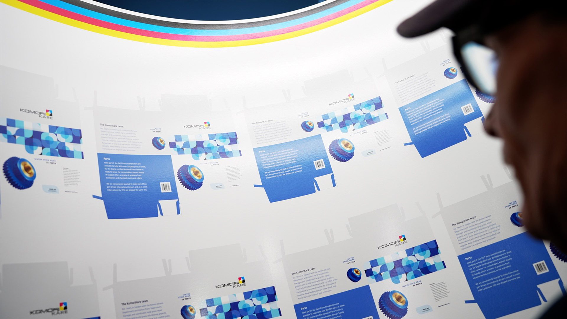 Shop employee inspects print job