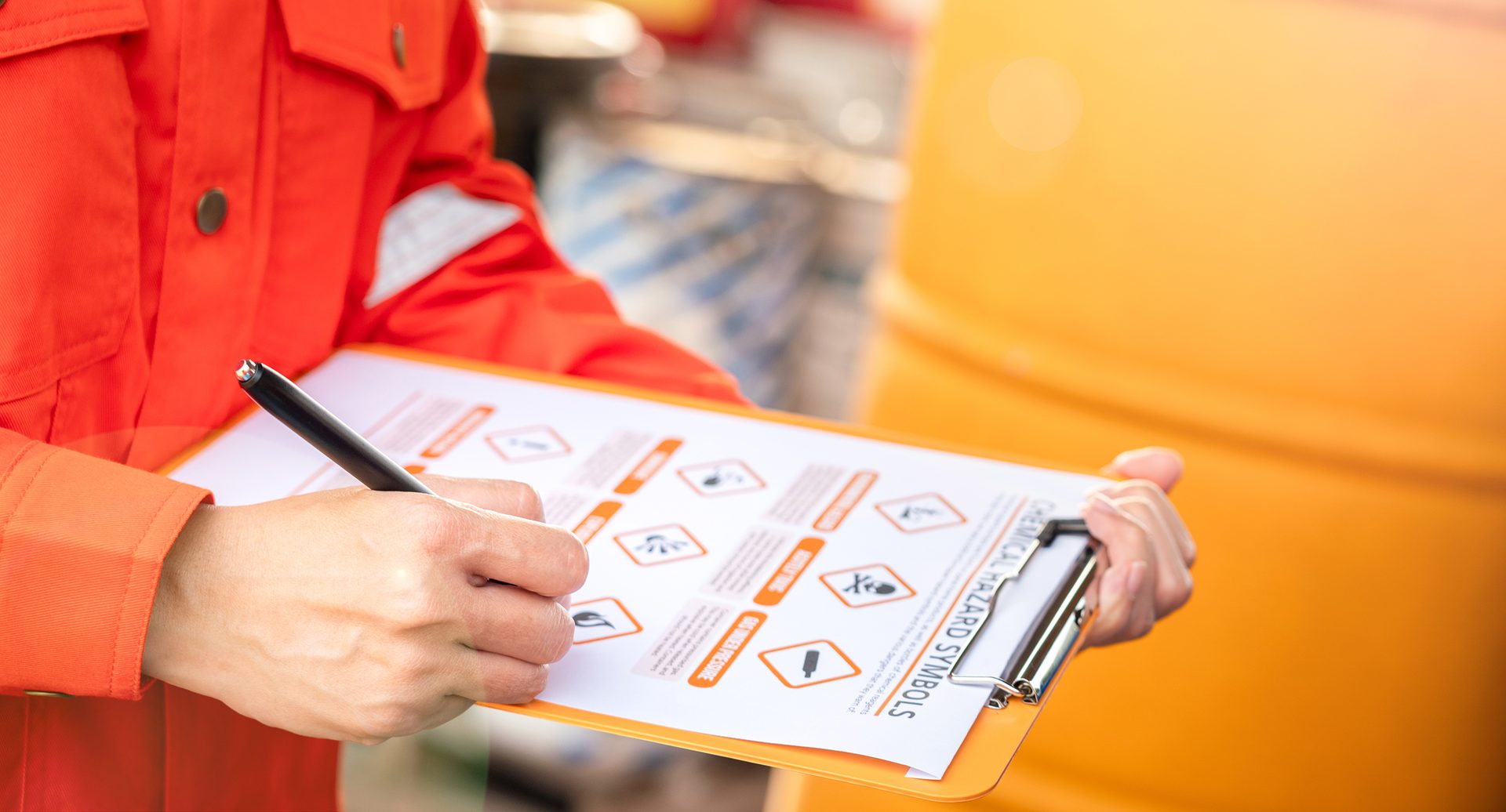 Environmental engineer is using hazardous material checklist form to correct the chemical safety at the factory storage area