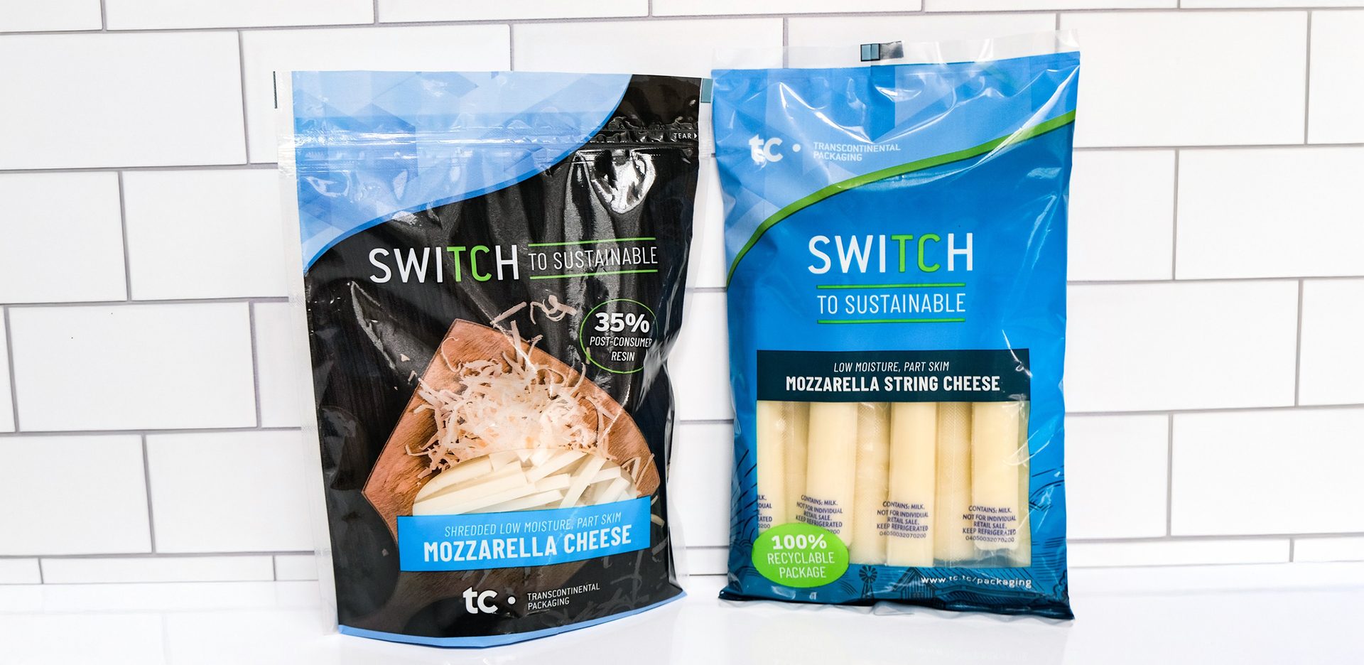 Pair of shredded cheese pouches against white background 