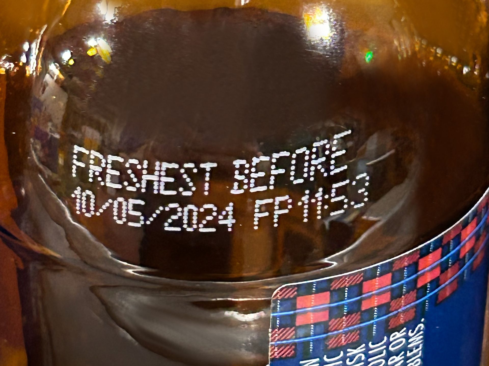 Image of beer bottle with expiration date printed on it